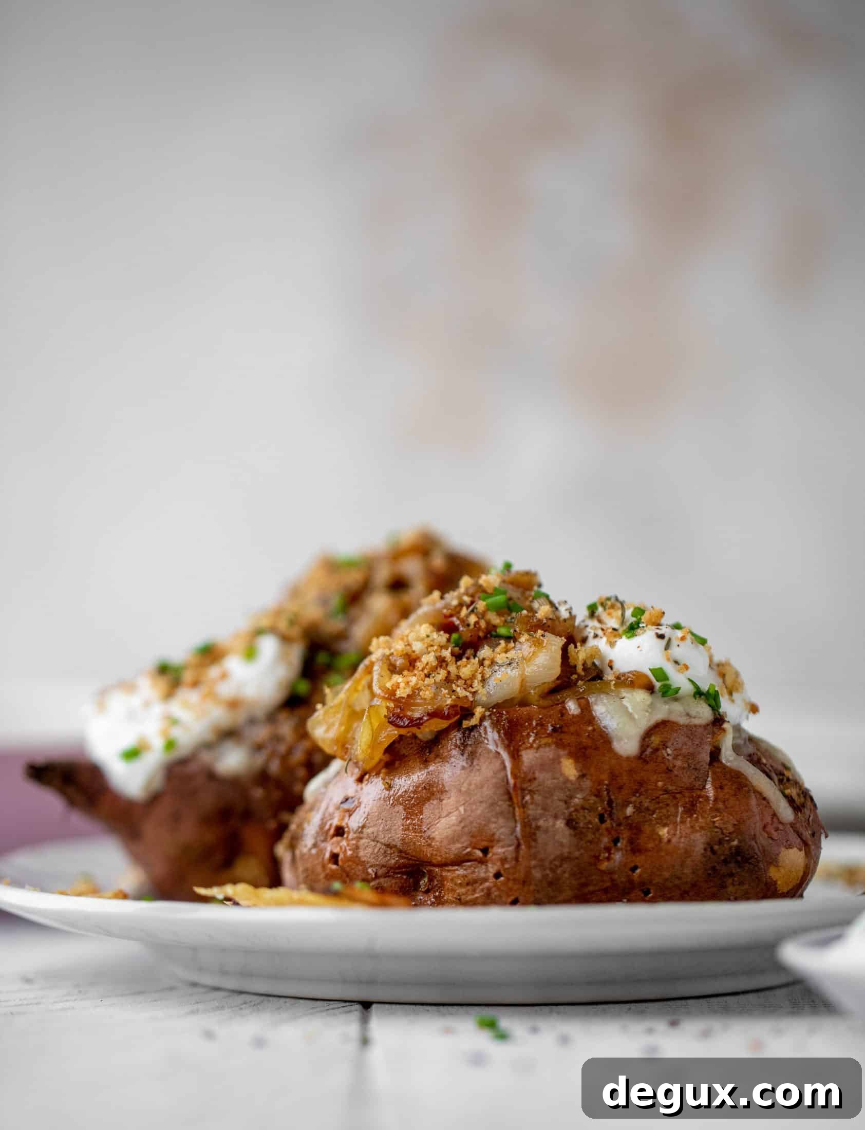 French Onion Stuffed Sweet Potatoes with Thyme Breadcrumb Crunch 8 These french onion stuffed sweet potatoes are slow roasted and topped with gruyere cheese and caramelized onions. Garlic butter bread crumbs finish them!