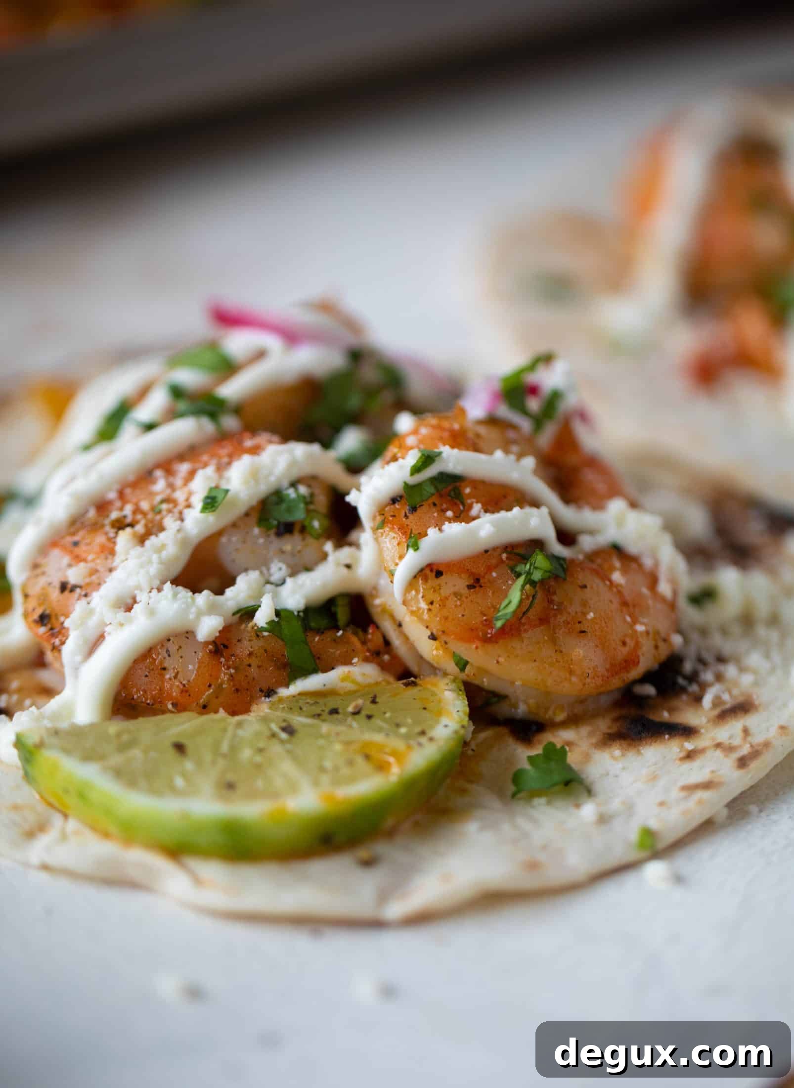 These lime sheet pan shrimp fajitas are the best weeknight meal! Make everything on the sheet pan and serve in warm tortillas. Delicious!