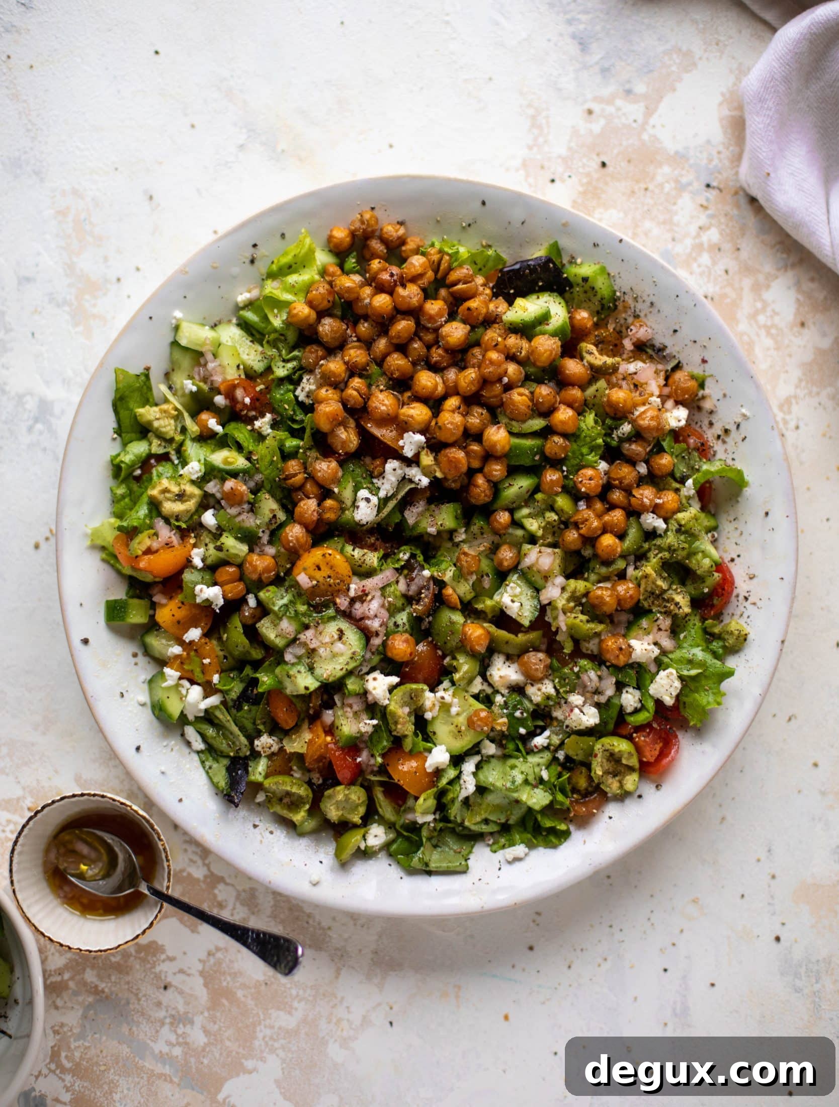 This crispy chickpea chopped salad is super simple and loaded with flavor. It's an incredible side or starter and a huge crowd pleaser!