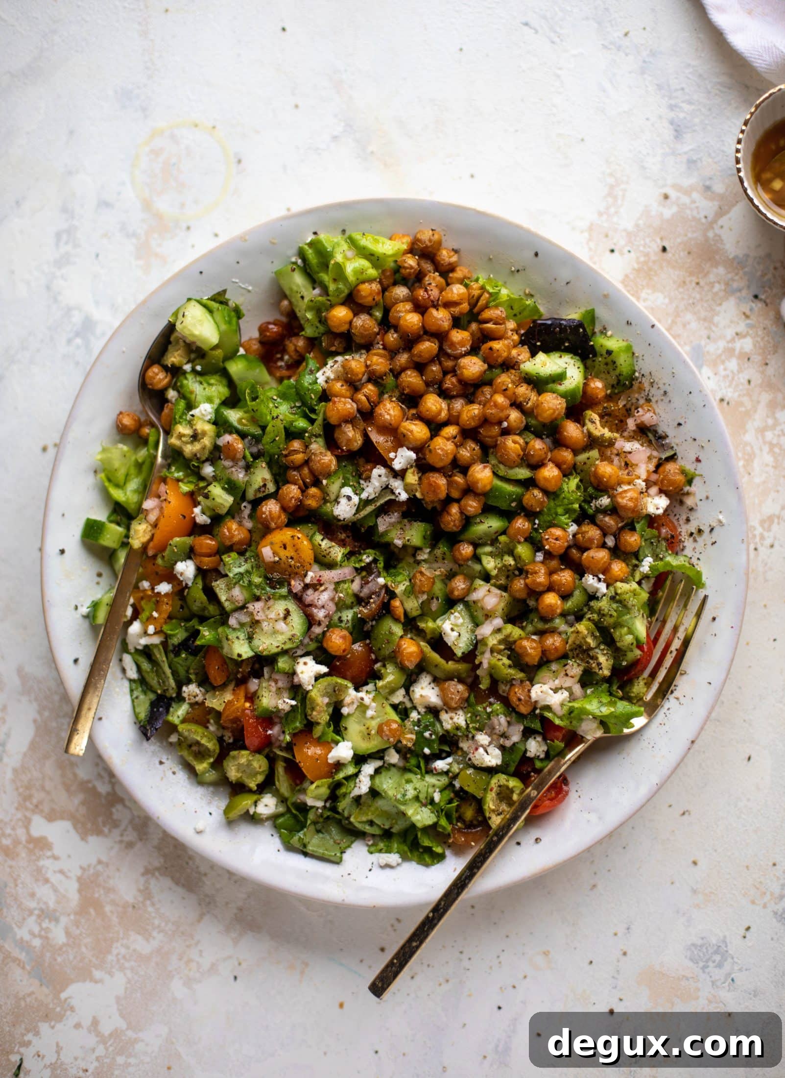 This crispy chickpea chopped salad is super simple and loaded with flavor. It's an incredible side or starter and a huge crowd pleaser!
