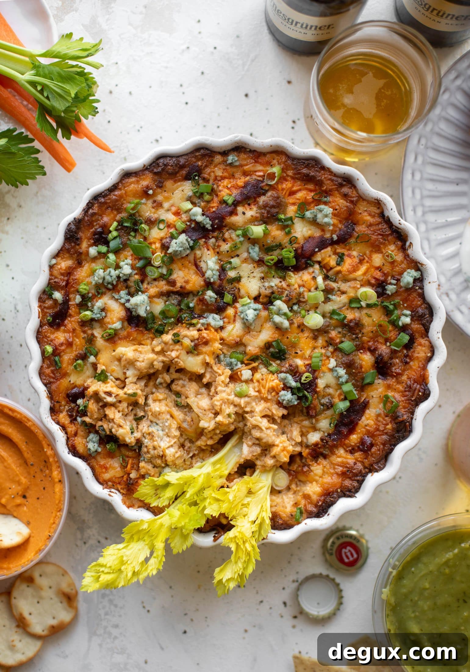 This loaded wing dip is full of buffalo wing sauce, BBQ sauce, honey mustard, ranch, blue cheese and tons of cheddar. All the flavors!