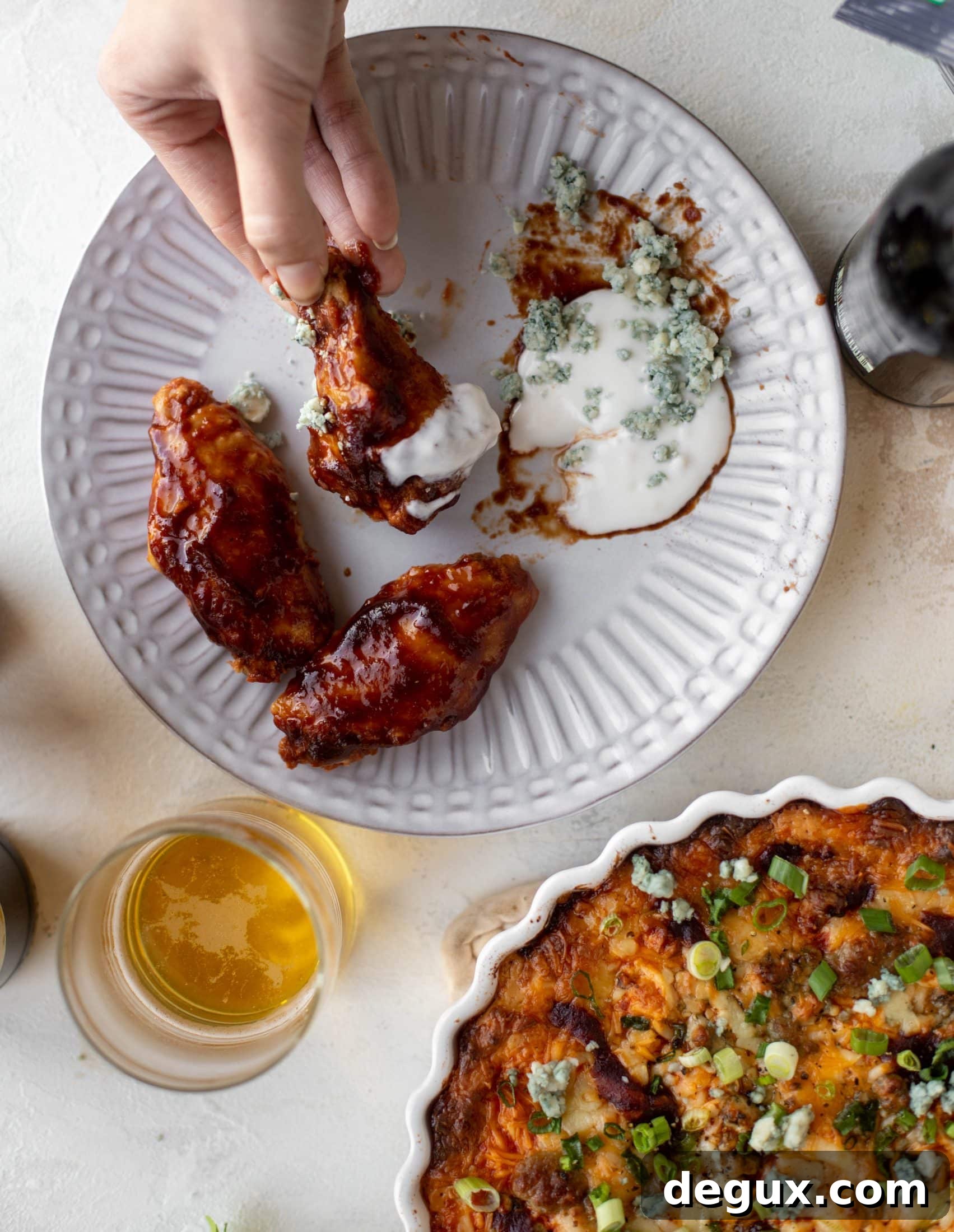 This loaded wing dip is full of buffalo wing sauce, BBQ sauce, honey mustard, ranch, blue cheese and tons of cheddar. All the flavors!