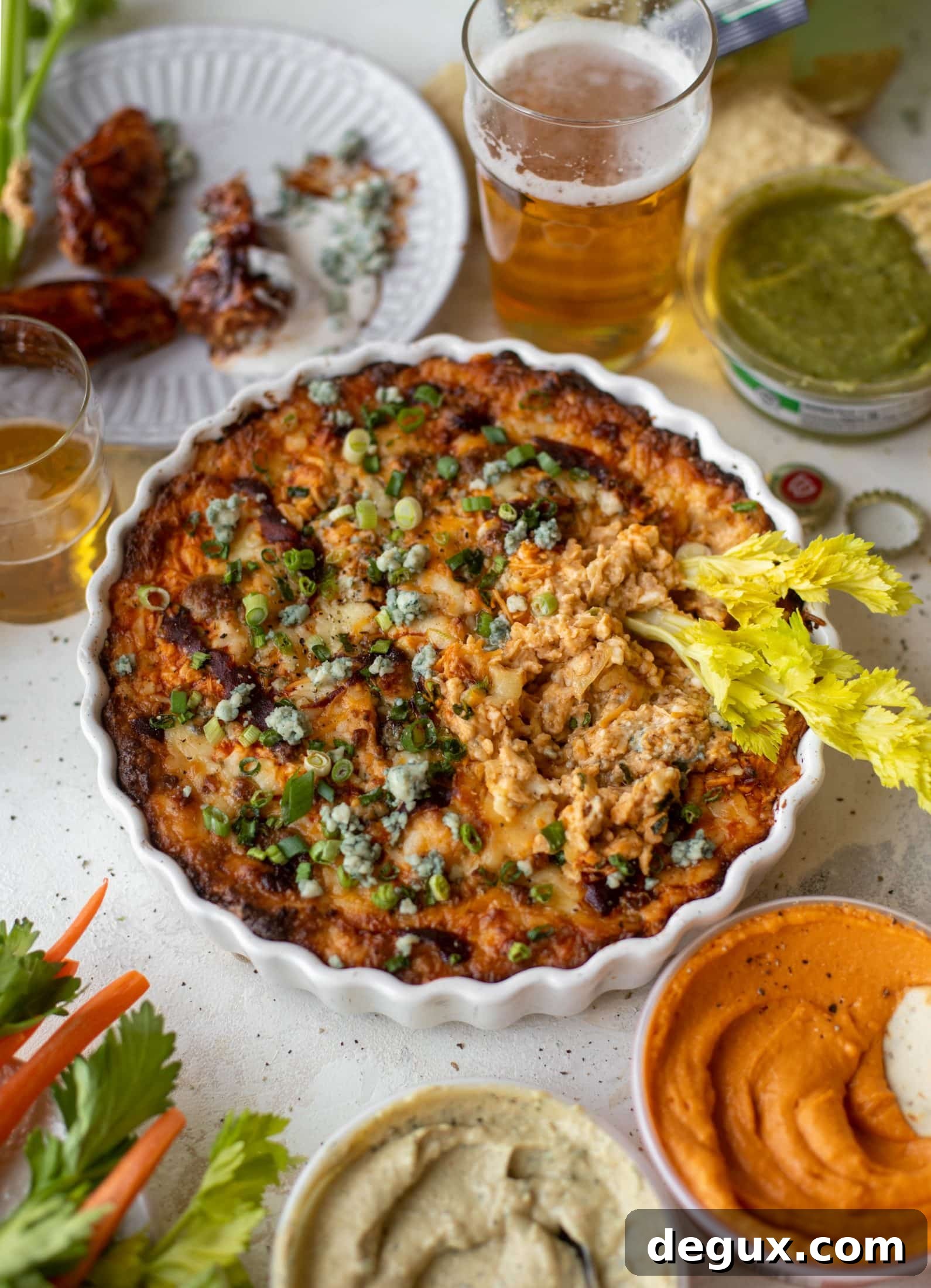 This loaded wing dip is full of buffalo wing sauce, BBQ sauce, honey mustard, ranch, blue cheese and tons of cheddar. All the flavors!