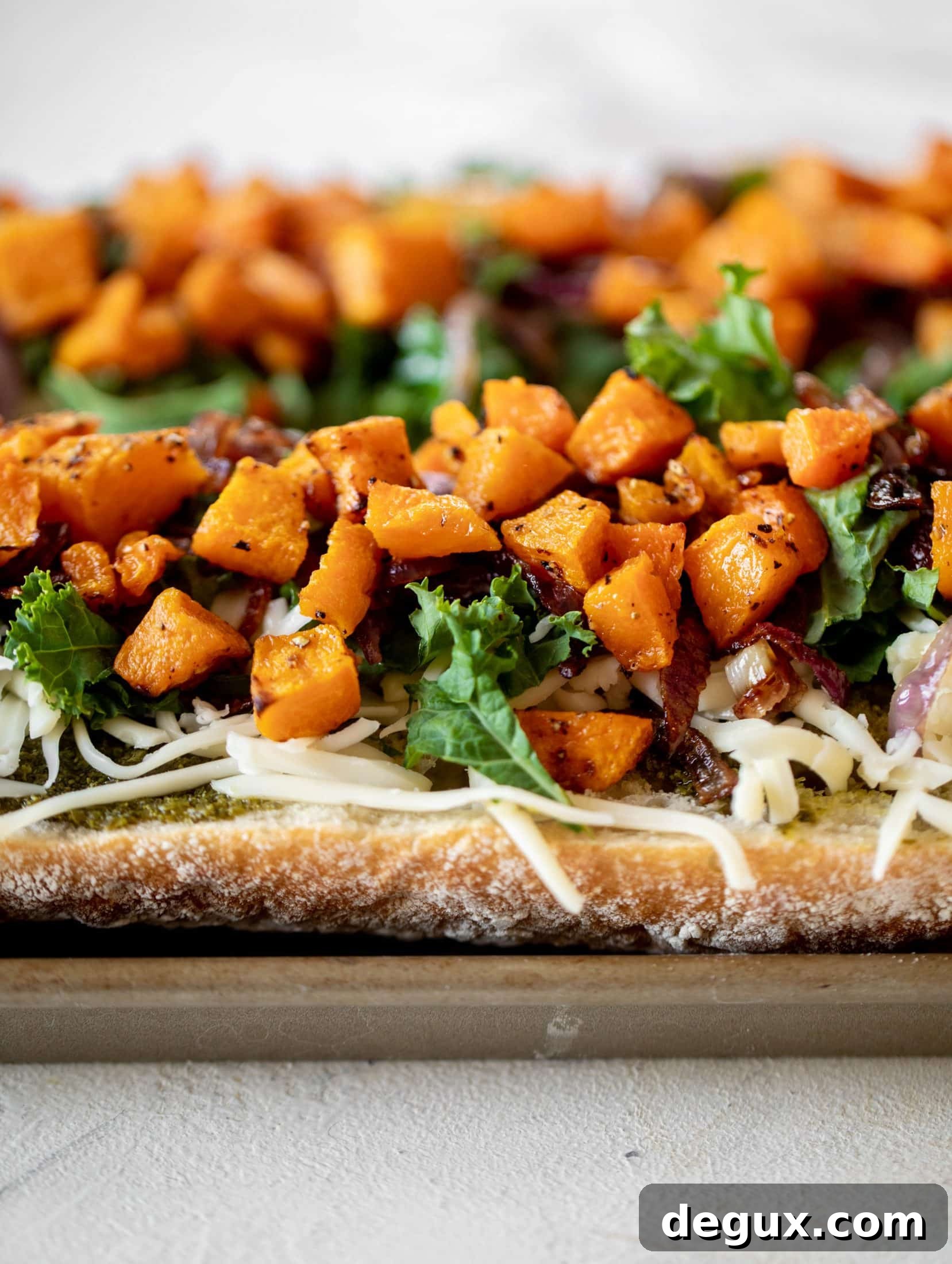 Roasted Butternut Squash Baguettes with Pesto and Crispy Kale 5 These butternut squash french breads have so much flavor. Pesto, caramelized onions, kale, roasted butternut and tons of fontina cheese. Delicious!
