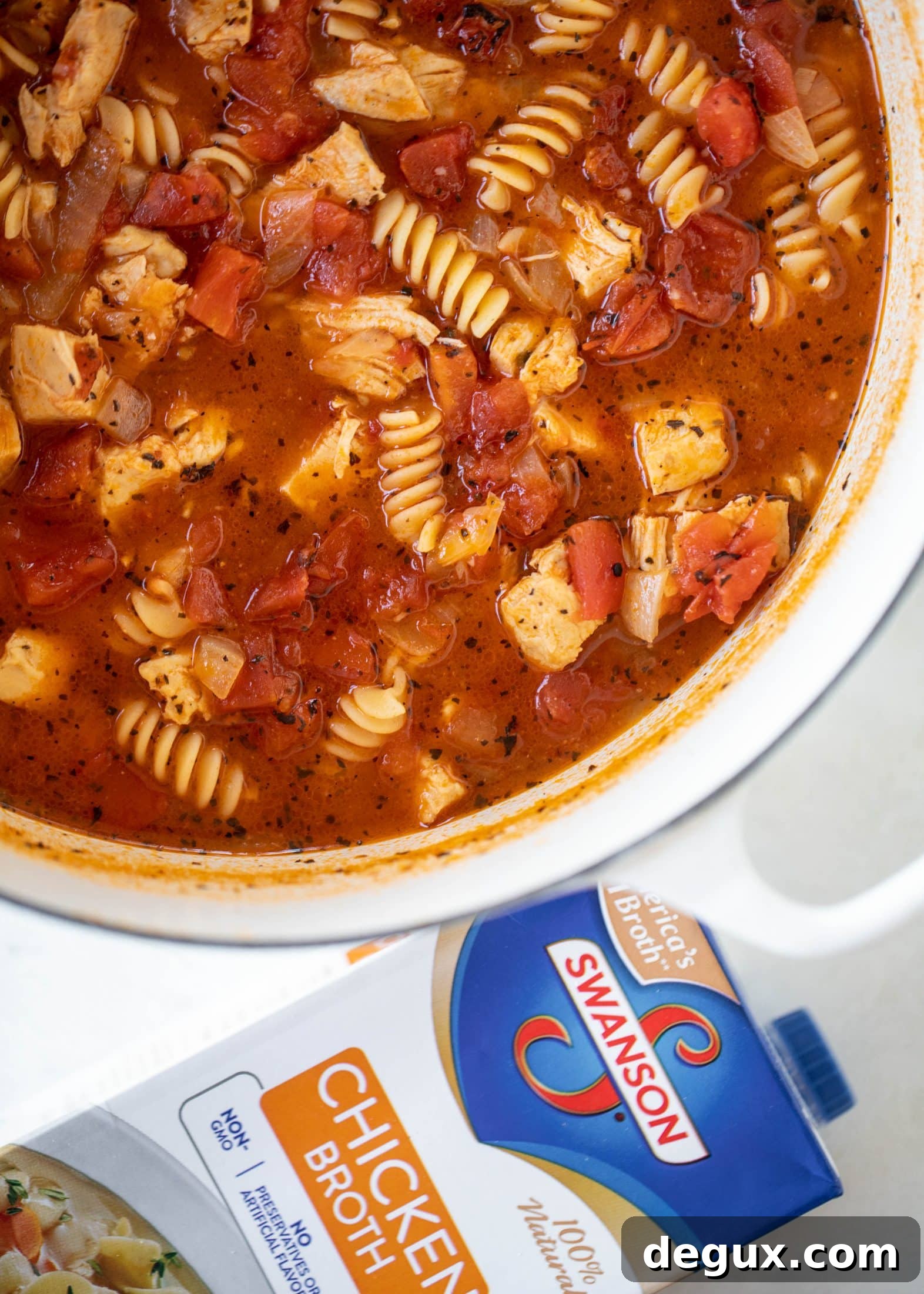 This chicken parmesan soup is ridiculously flavorful and so easy to make! Juicy chicken with pasta, fire roasted tomatoes and mozzarella croutons.