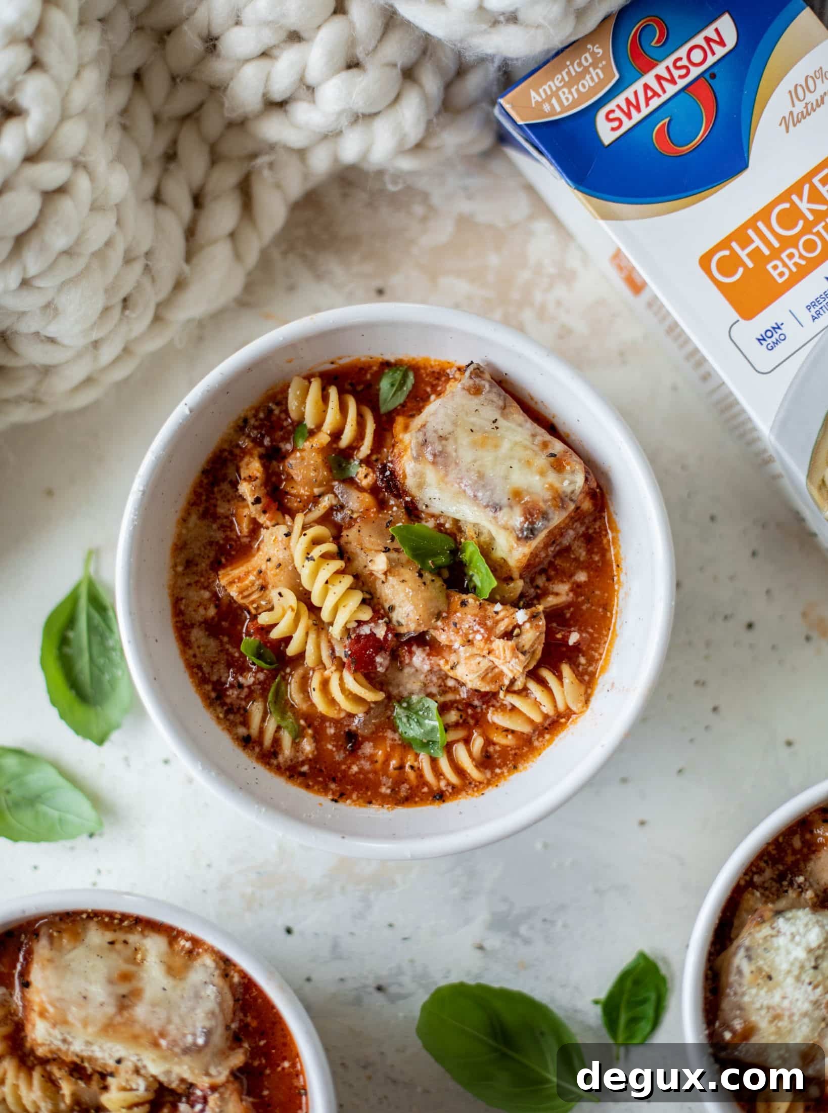 This chicken parmesan soup is ridiculously flavorful and so easy to make! Juicy chicken with pasta, fire roasted tomatoes and mozzarella croutons.