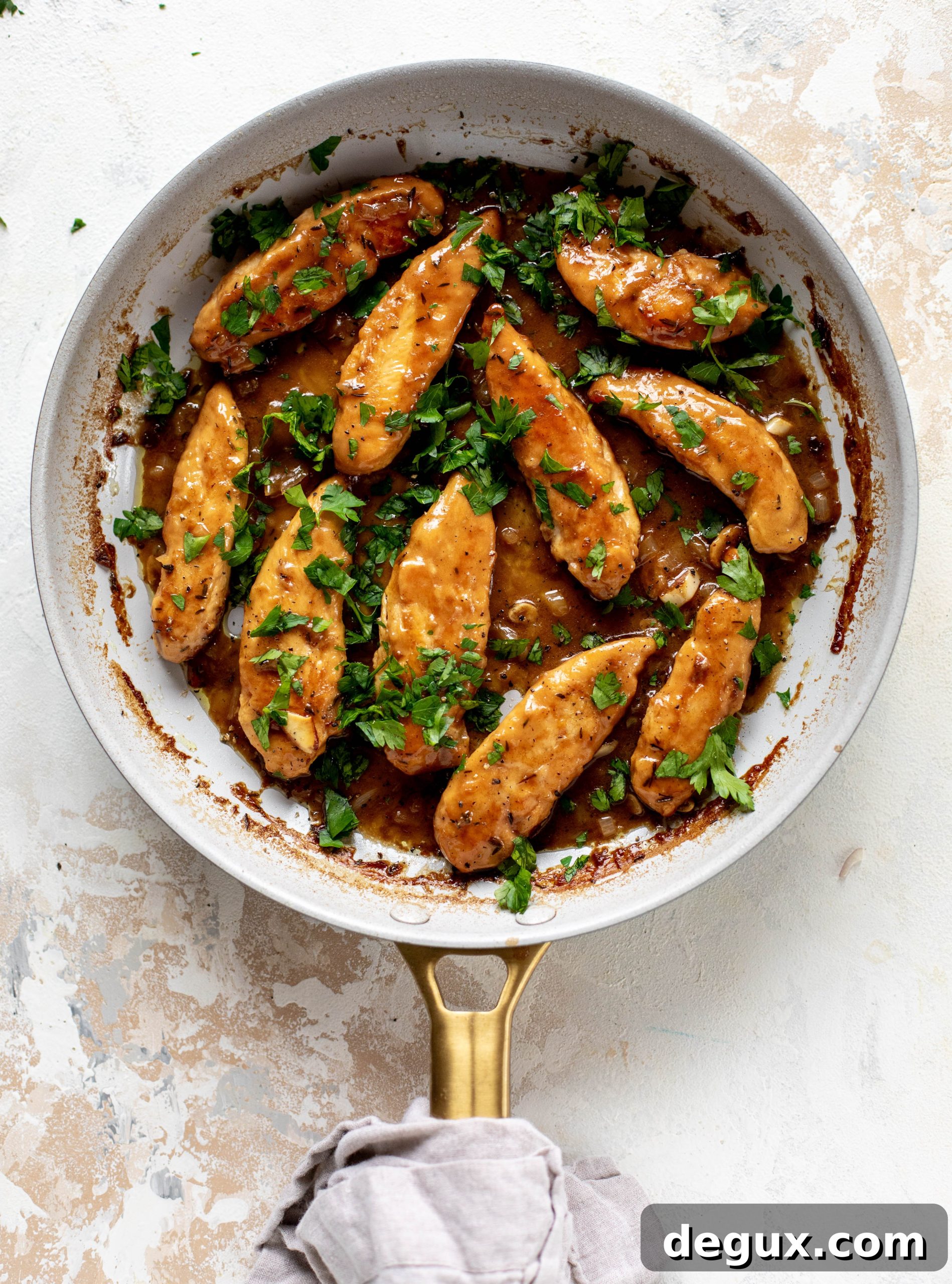 My mom's chicken marsala is easy and ridiculously flavorful! It's made without mushrooms and served alongside almond brown butter green beans.