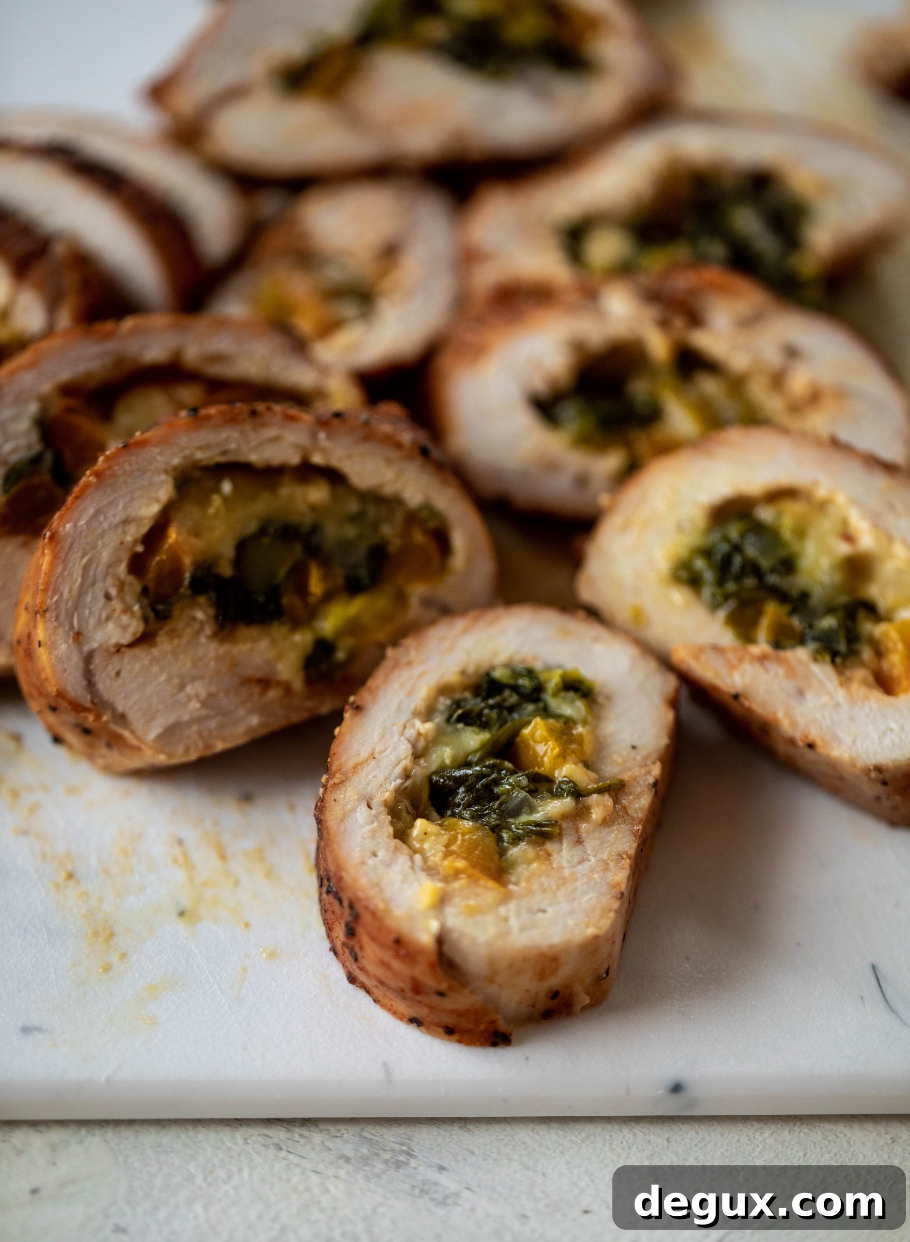 These southwest stuffed turkey tenderloins are so flavorful and filled with spinach, peppers, onions and cheddar! Serve alongside a lime black bean salad.