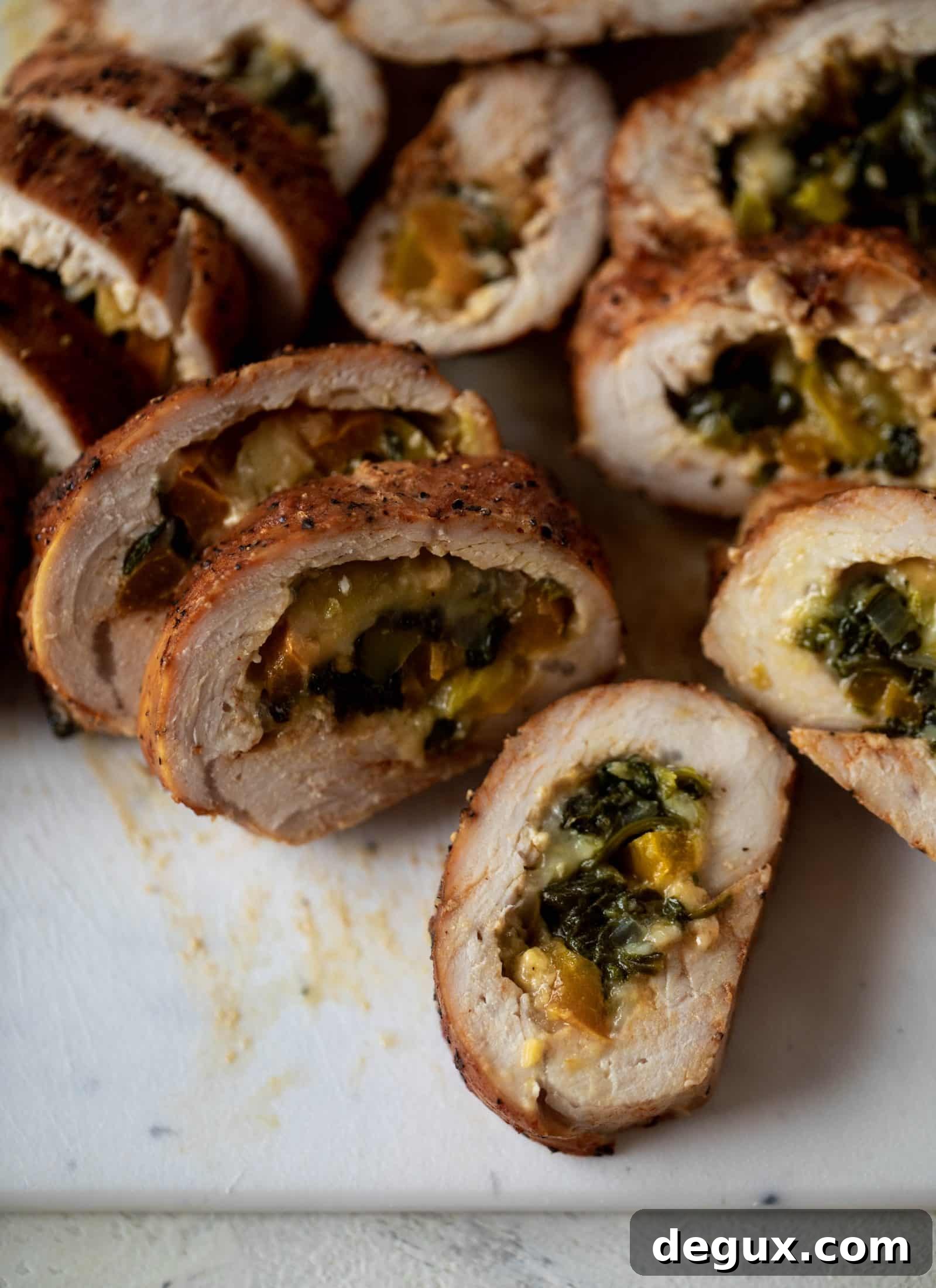 These southwest stuffed turkey tenderloins are so flavorful and filled with spinach, peppers, onions and cheddar! Serve alongside a lime black bean salad.