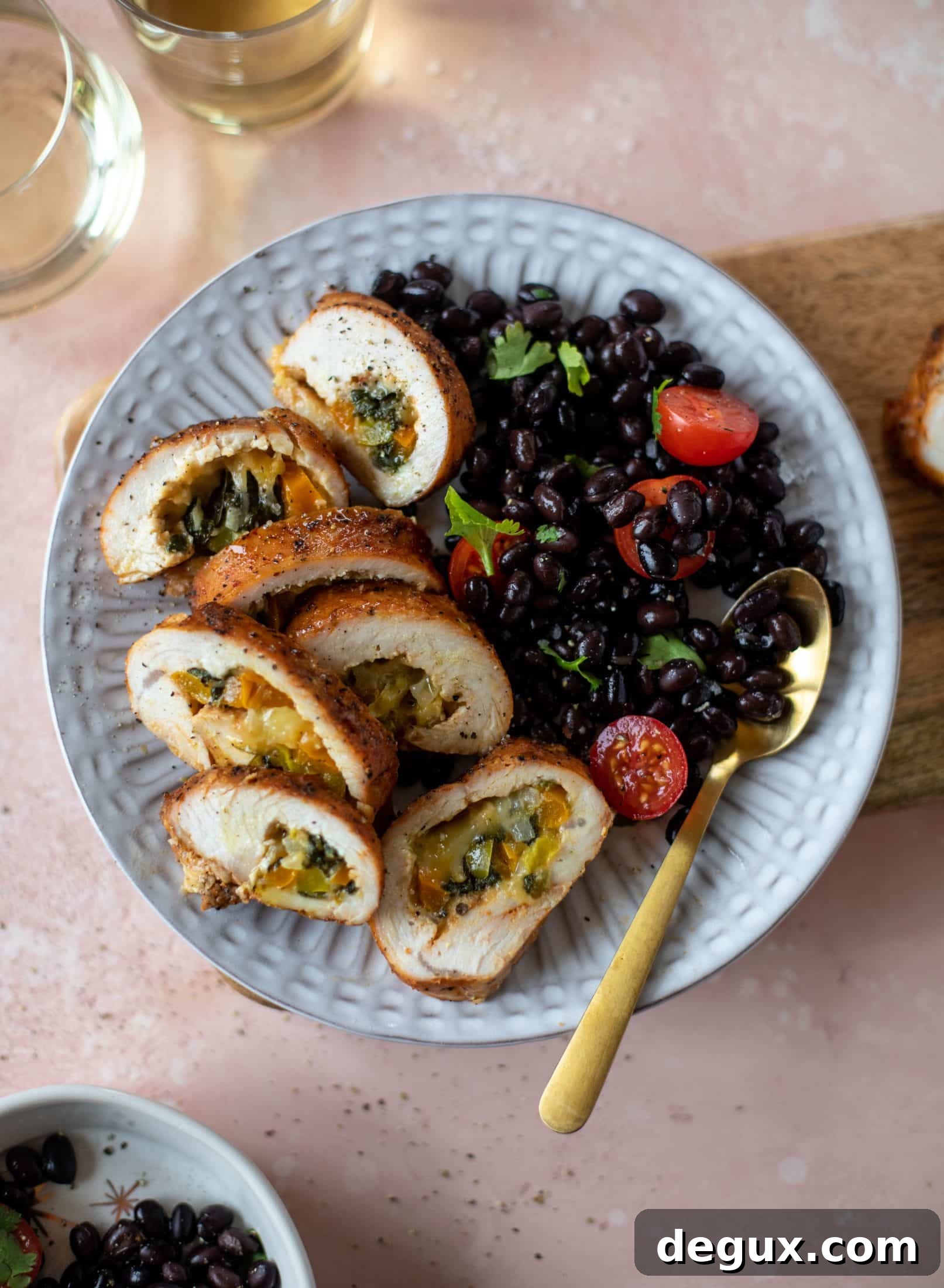 These southwest stuffed turkey tenderloins are so flavorful and filled with spinach, peppers, onions and cheddar! Serve alongside a lime black bean salad.