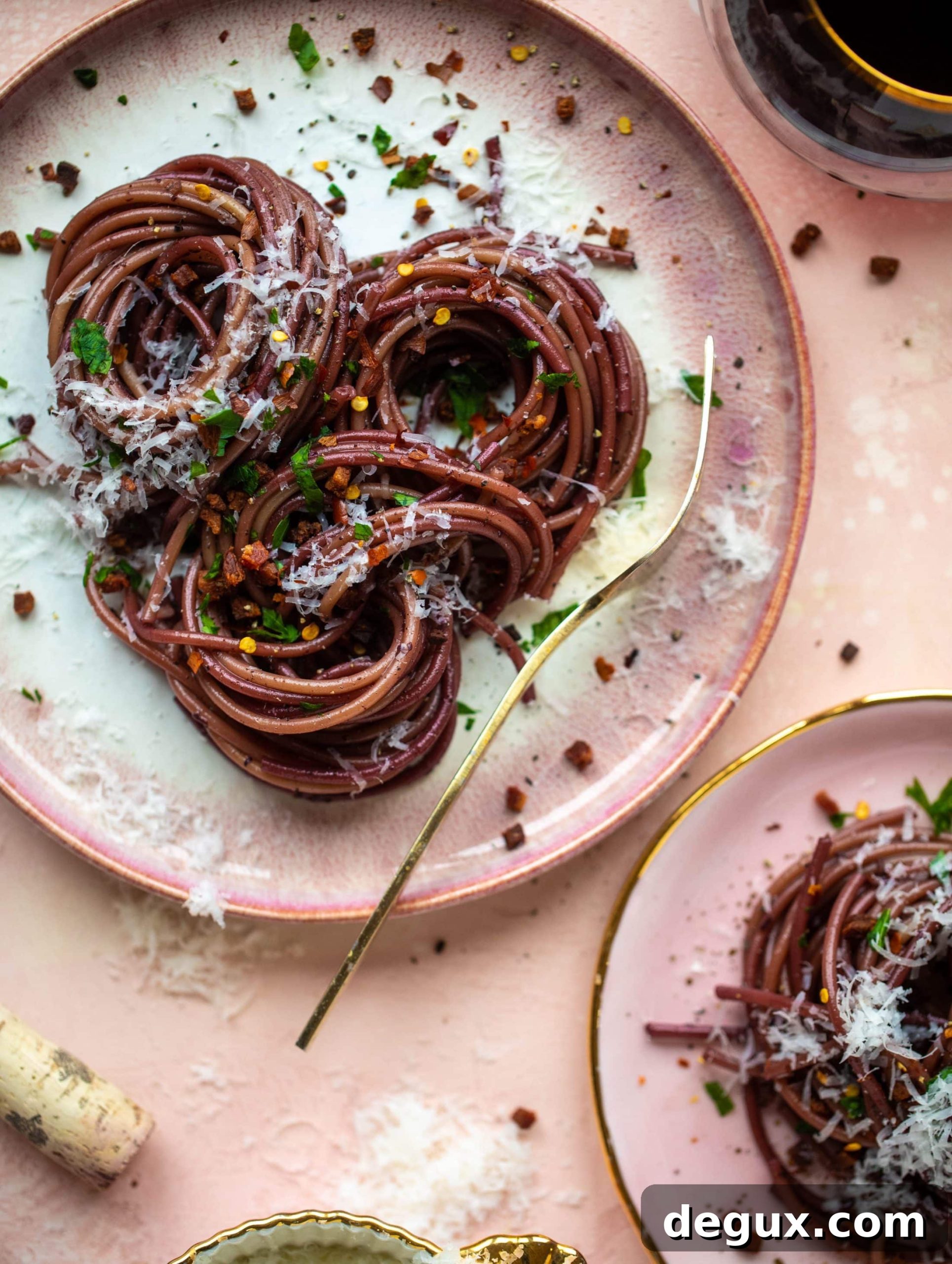 Bucatini in Red Wine Sauce with Pancetta and Parmesan 2 This red wine pasta is an easy, flavorful dinner! Red wine cooked down with garlic and butter until sauce-like. Throw in noodles and you have dinner!