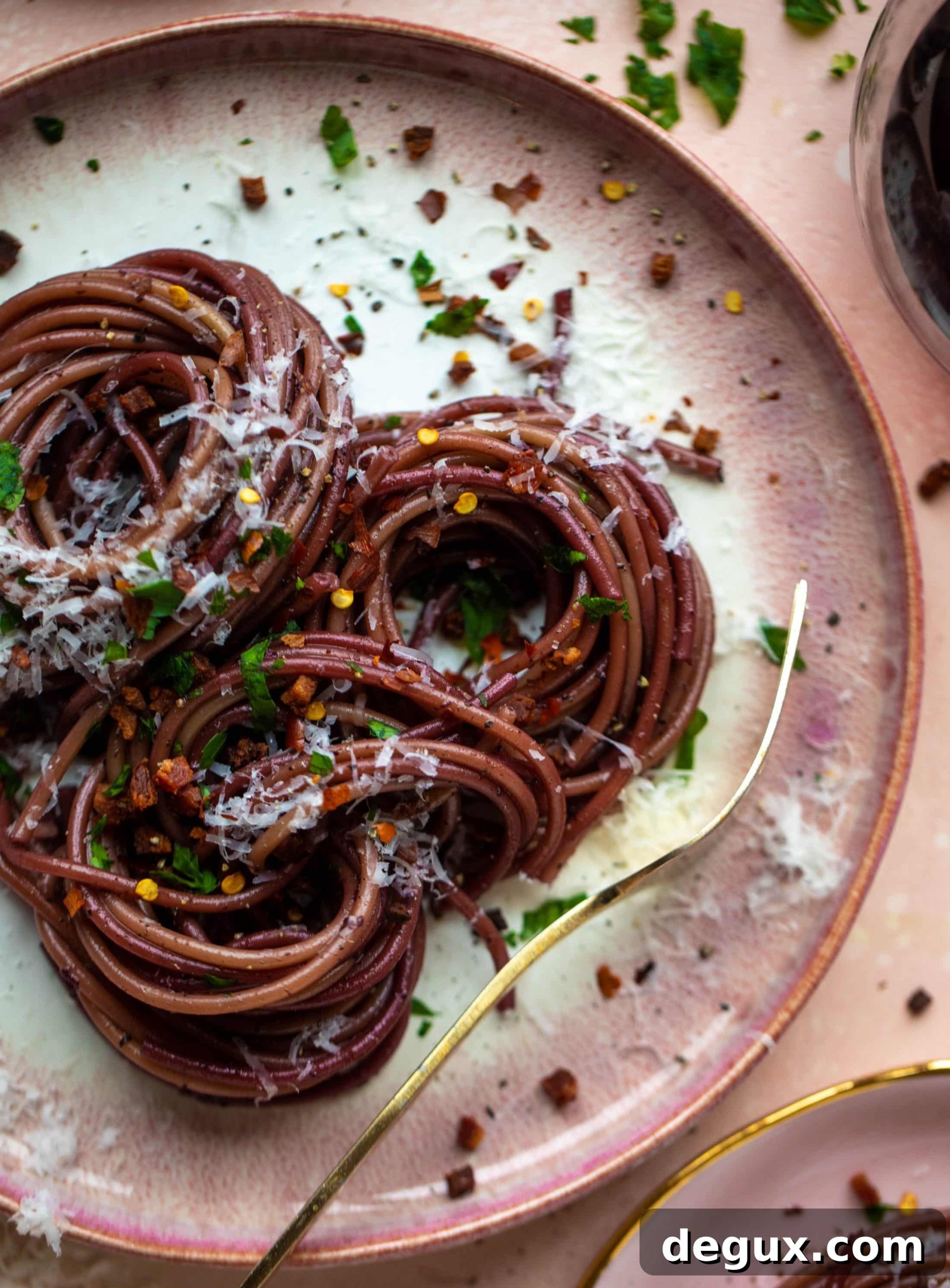 Bucatini in Red Wine Sauce with Pancetta and Parmesan 10 This red wine pasta is an easy, flavorful dinner! Red wine cooked down with garlic and butter until sauce-like. Throw in noodles and you have dinner!
