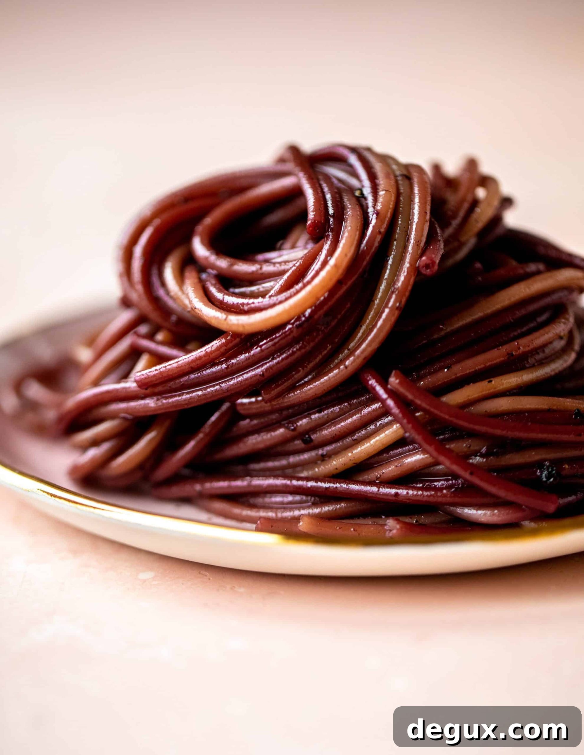 Bucatini in Red Wine Sauce with Pancetta and Parmesan 6 This red wine pasta is an easy, flavorful dinner! Red wine cooked down with garlic and butter until sauce-like. Throw in noodles and you have dinner!
