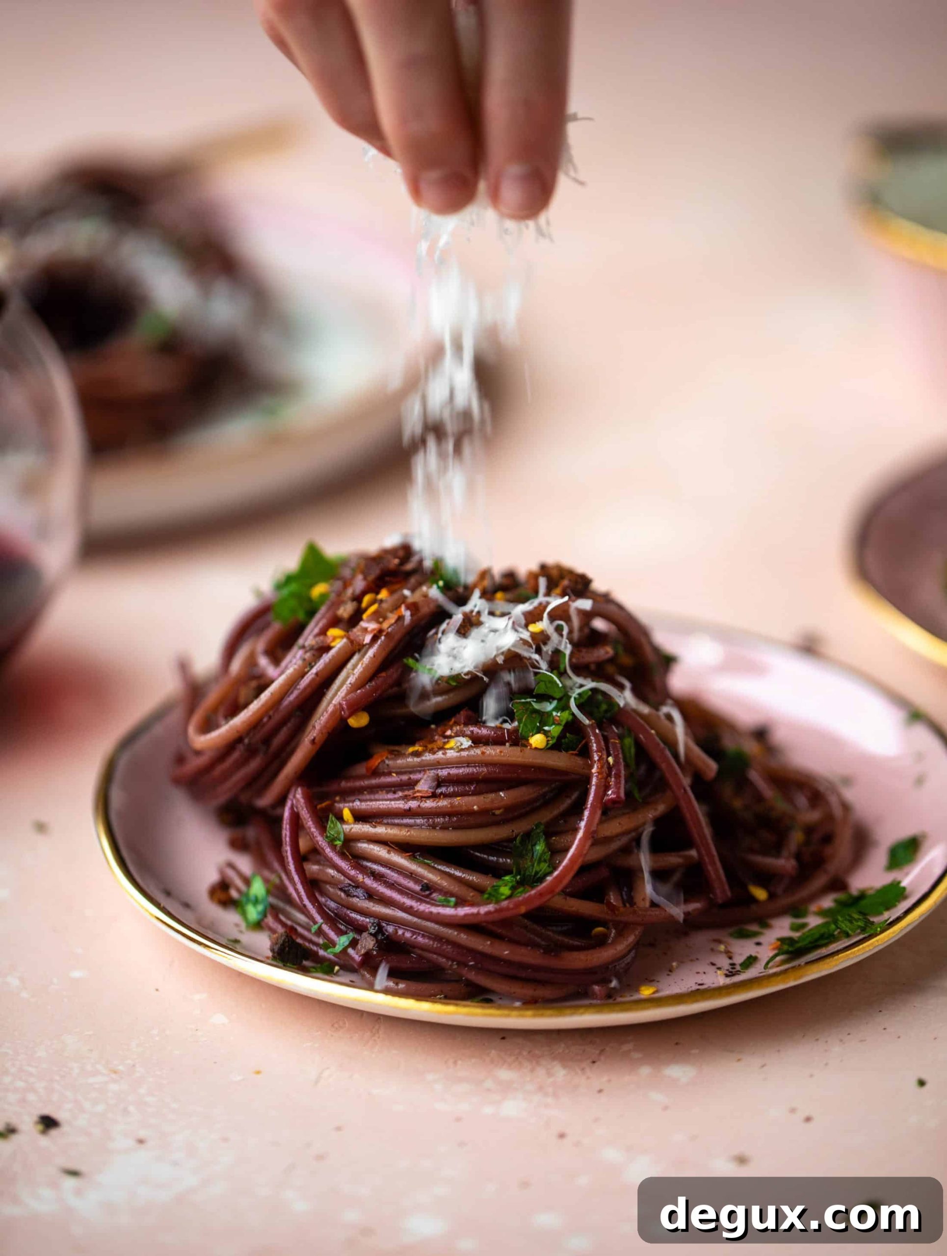 Bucatini in Red Wine Sauce with Pancetta and Parmesan 7 This red wine pasta is an easy, flavorful dinner! Red wine cooked down with garlic and butter until sauce-like. Throw in noodles and you have dinner!