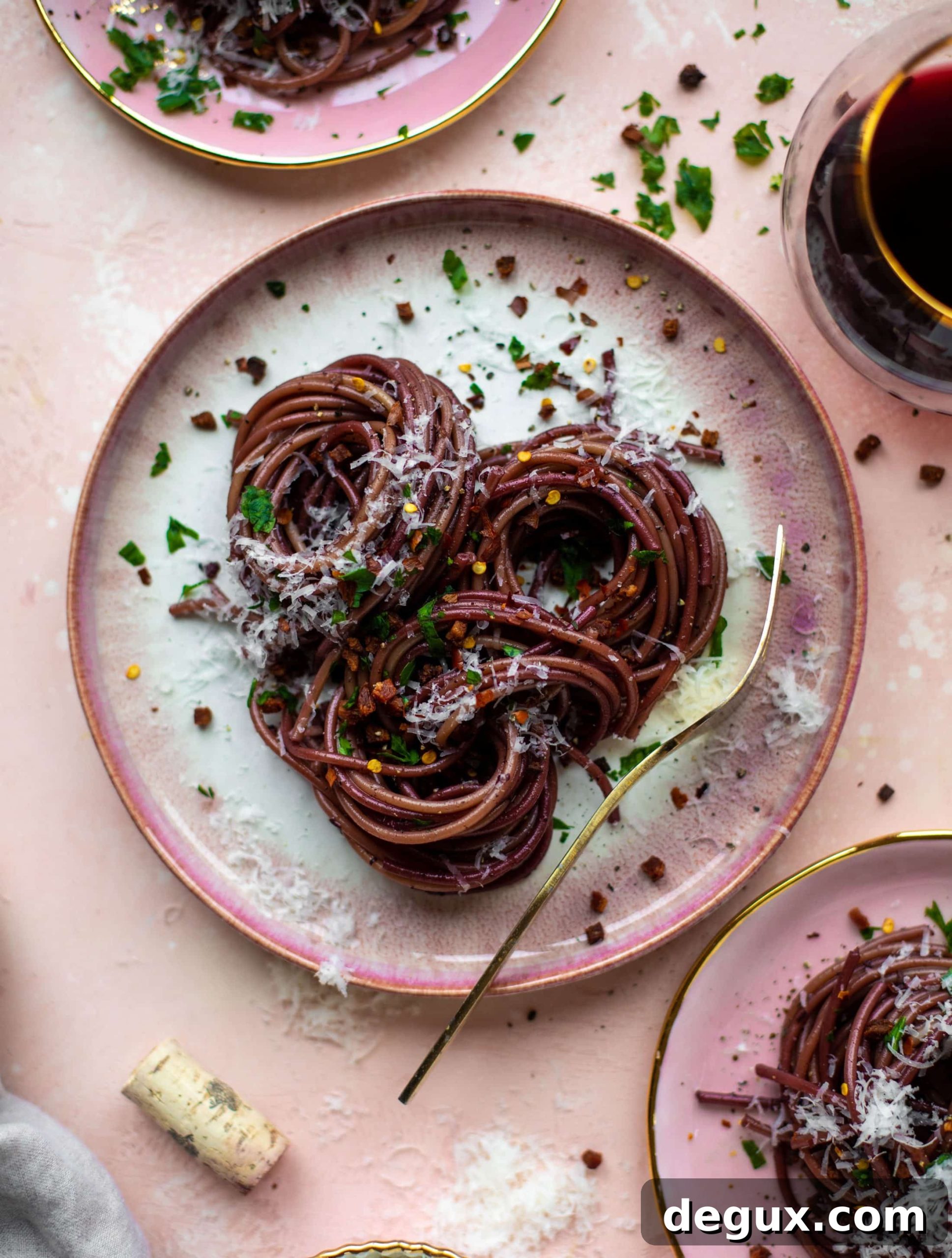 Bucatini in Red Wine Sauce with Pancetta and Parmesan 8 This red wine pasta is an easy, flavorful dinner! Red wine cooked down with garlic and butter until sauce-like. Throw in noodles and you have dinner!