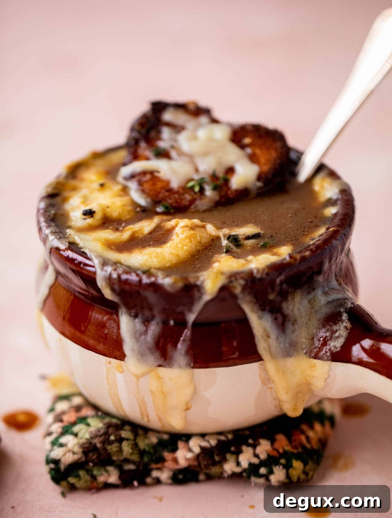 My favorite french onion soup starts with bourbon caramelized onions! Adorable heart croutons and tons of gruyere take it over the top.