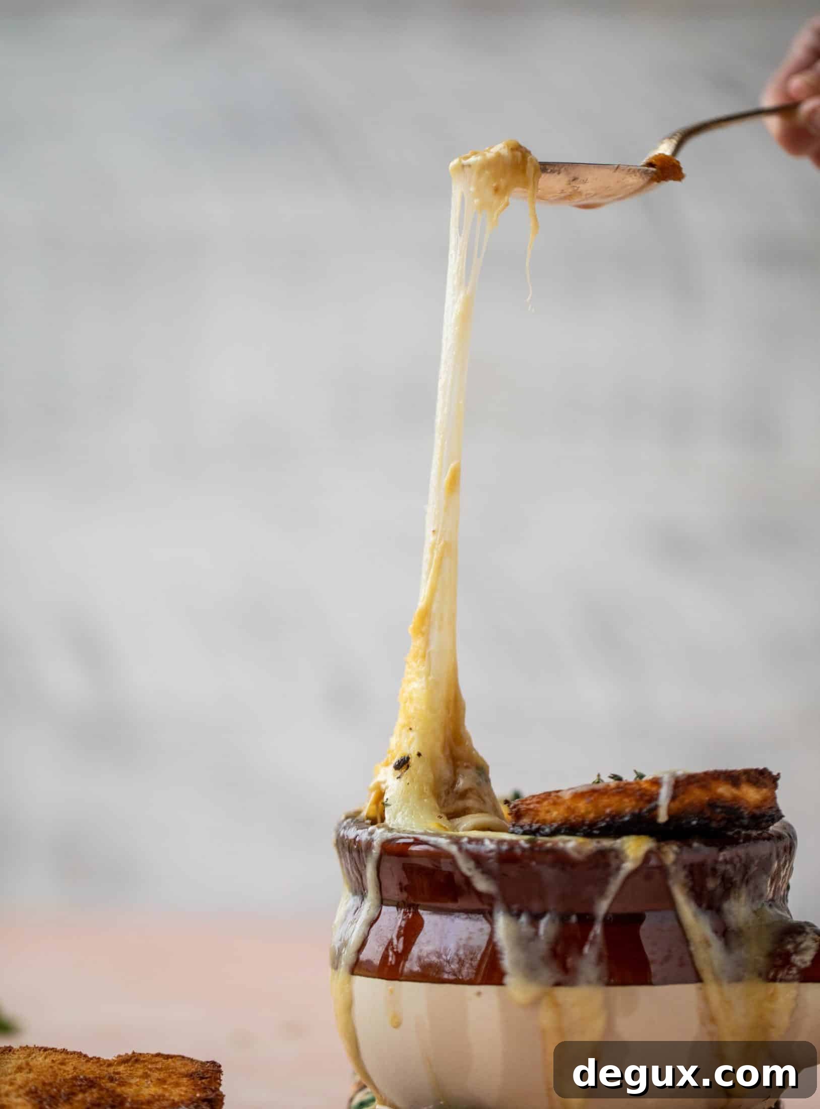 My favorite french onion soup starts with bourbon caramelized onions! Adorable heart croutons and tons of gruyere take it over the top.