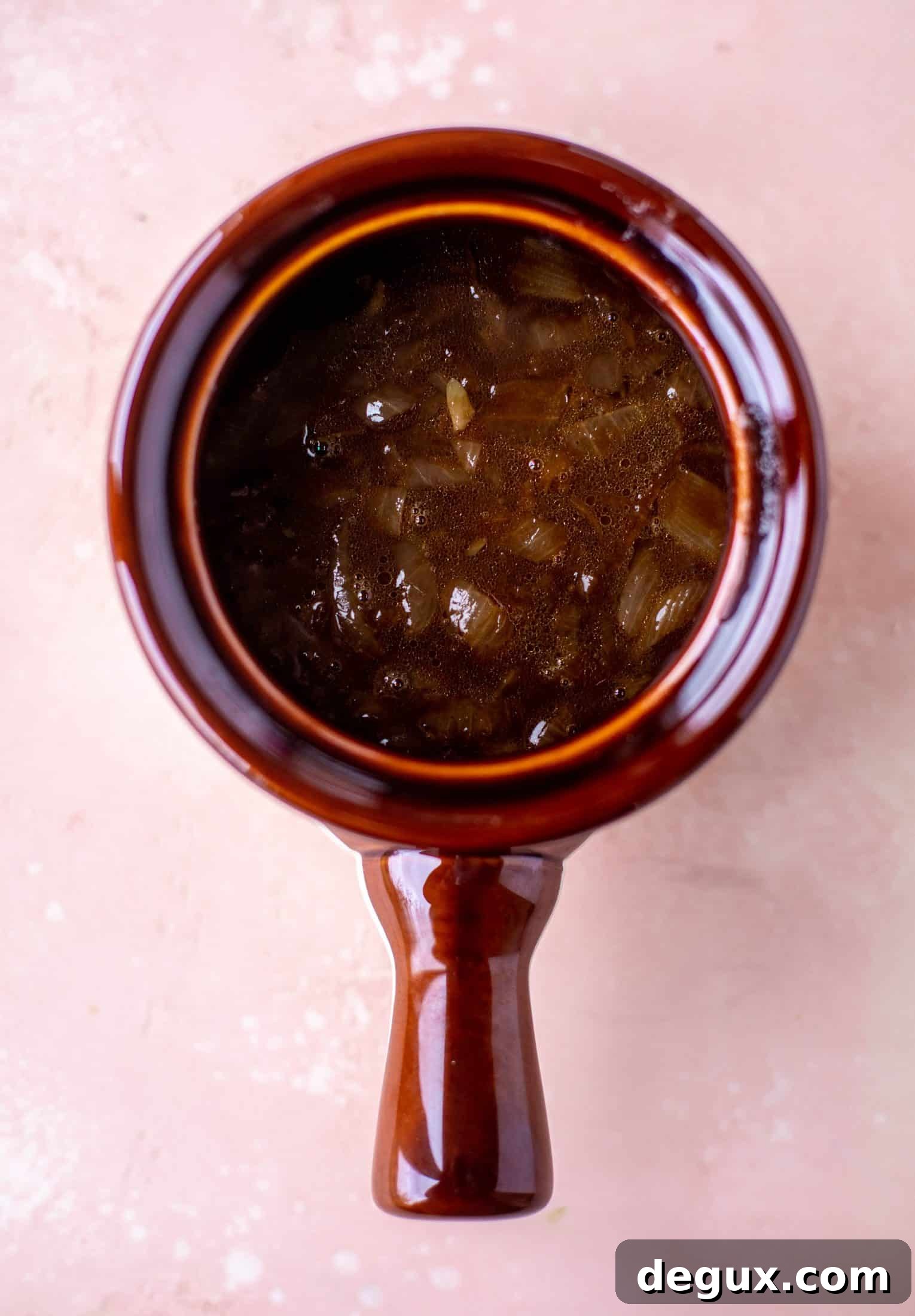 My favorite french onion soup starts with bourbon caramelized onions! Adorable heart croutons and tons of gruyere take it over the top.