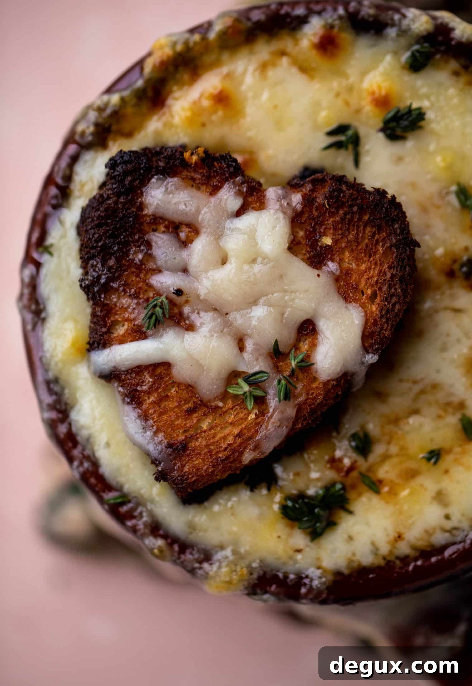 My favorite french onion soup starts with bourbon caramelized onions! Adorable heart croutons and tons of gruyere take it over the top.