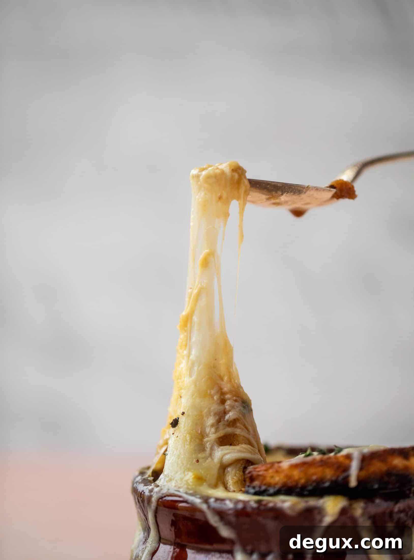 My favorite french onion soup starts with bourbon caramelized onions! Adorable heart croutons and tons of gruyere take it over the top.