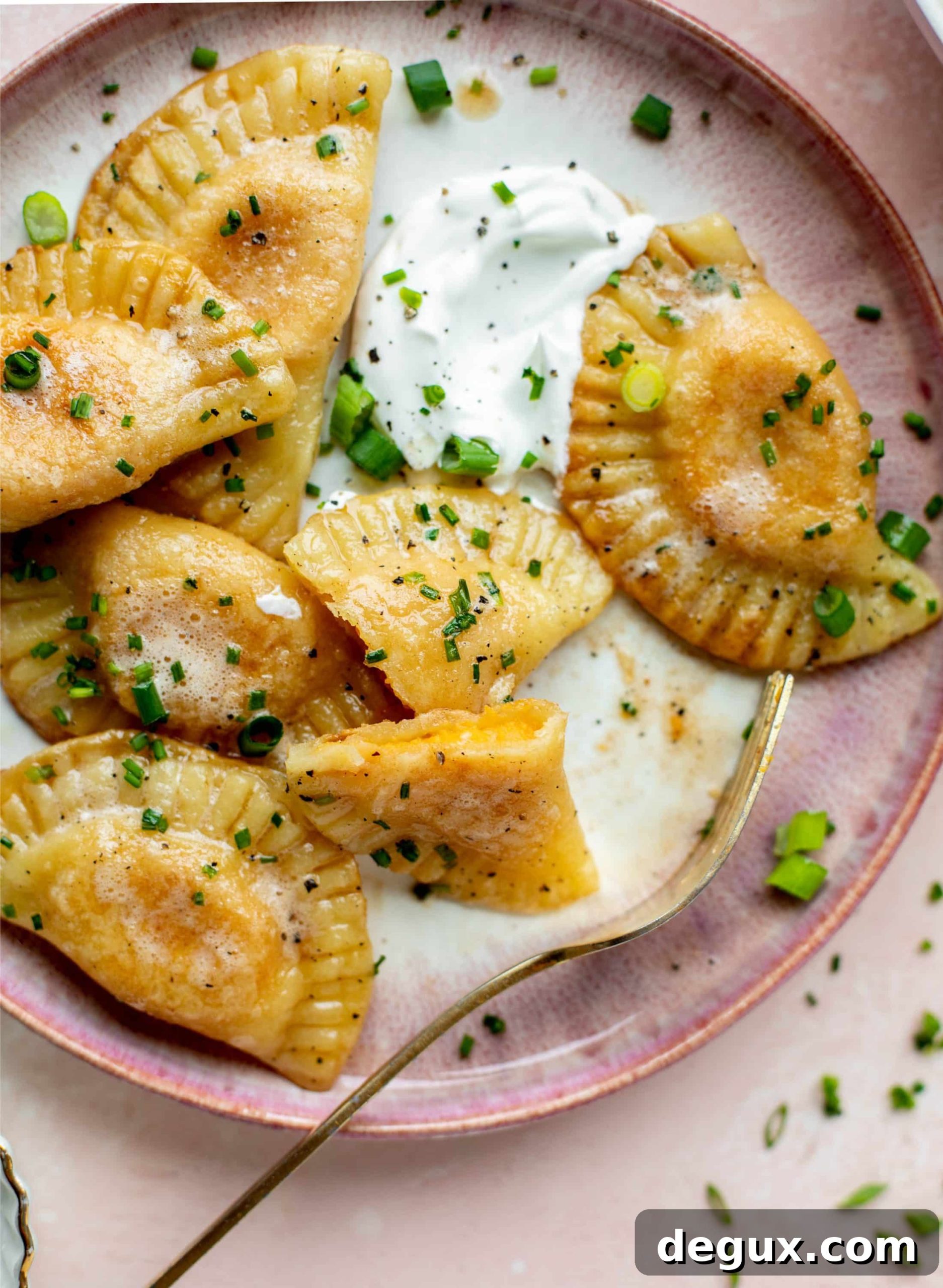 Sweet Potato and Fontina Pierogies with Brown Butter Sauce 9 The most delicious sweet potato pierogi recipe! Roasted sweet potato and fontina cheese in pillowy dough. Make sure to serve with brown butter!