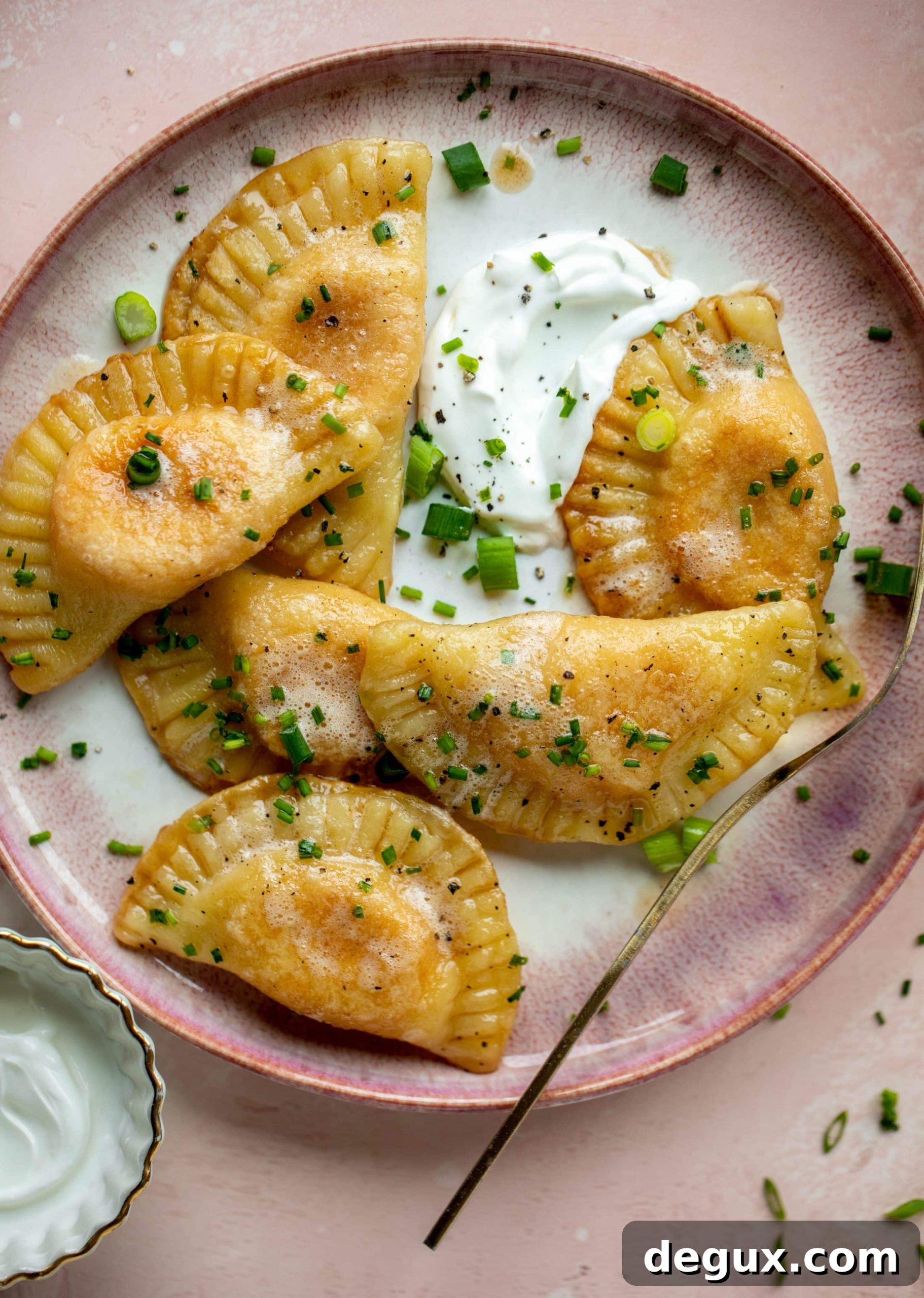 Sweet Potato and Fontina Pierogies with Brown Butter Sauce 11 The most delicious sweet potato pierogi recipe! Roasted sweet potato and fontina cheese in pillowy dough. Make sure to serve with brown butter!