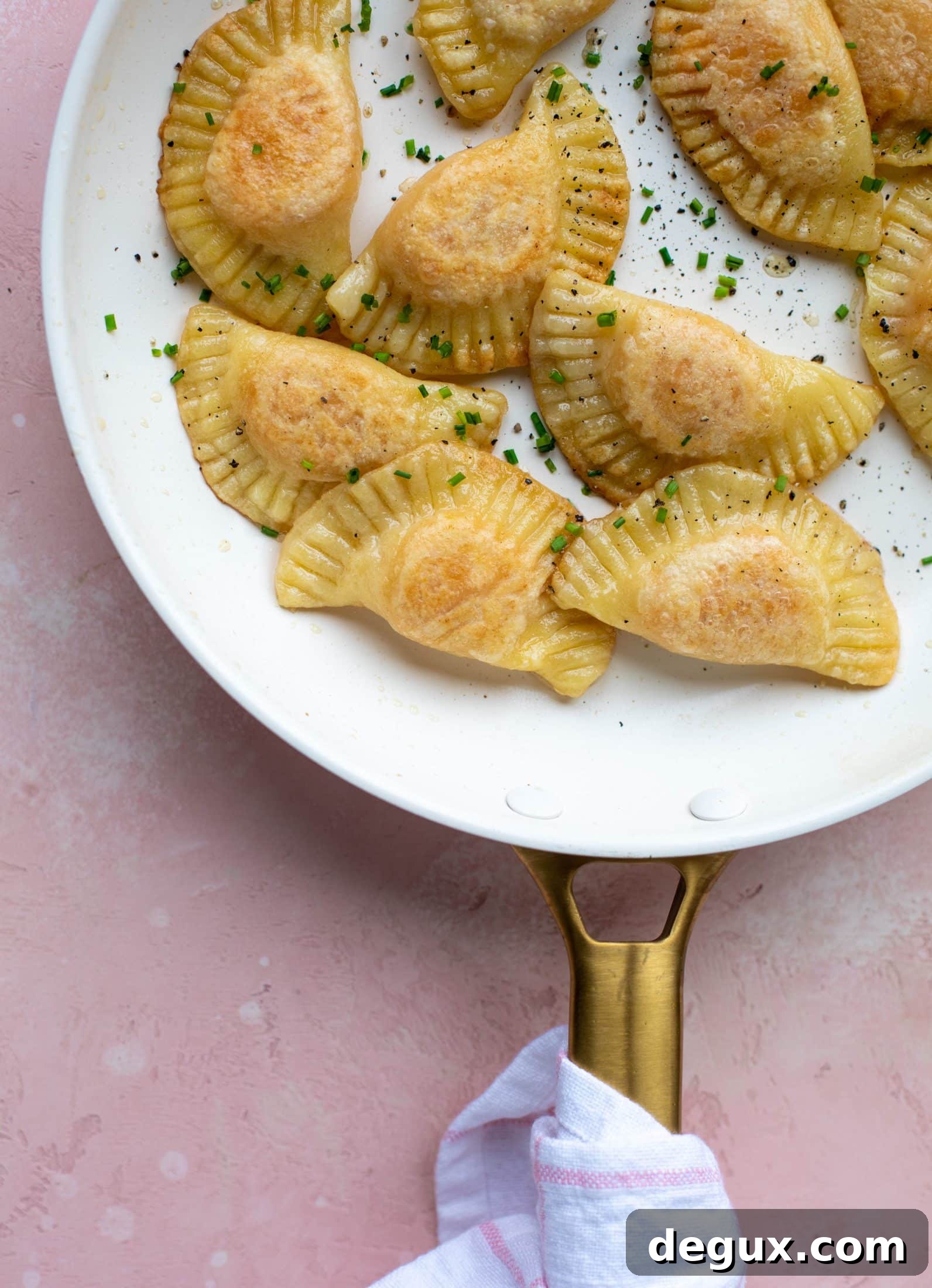 Sweet Potato and Fontina Pierogies with Brown Butter Sauce 7 The most delicious sweet potato pierogi recipe! Roasted sweet potato and fontina cheese in pillowy dough. Make sure to serve with brown butter!