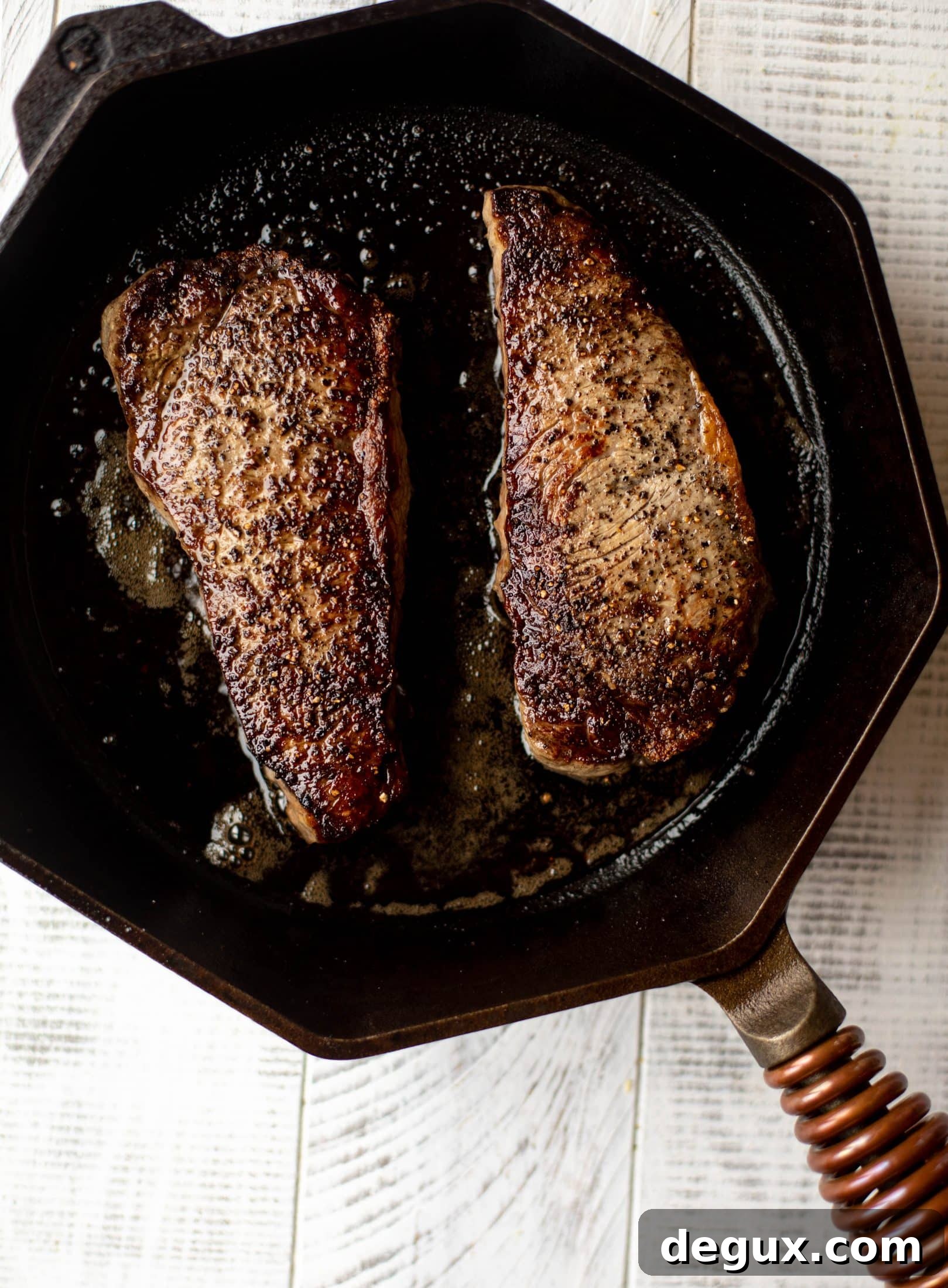 This is our favorite steak frites! Seared skillet steak and crispy fries made in the air fryer, topped with truffle salt, parmesan and herbs!