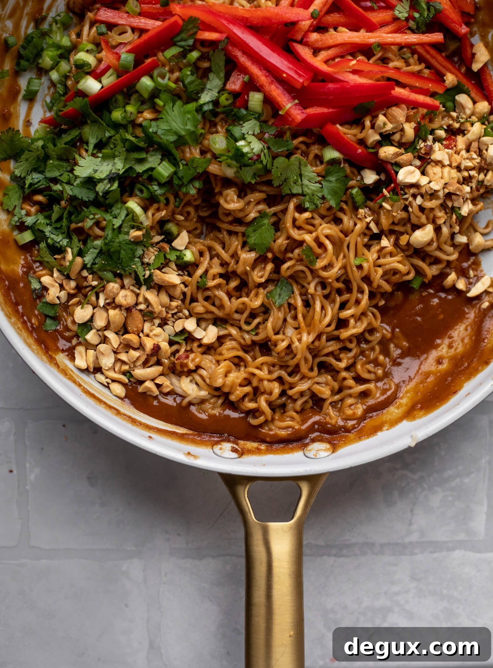 These are the most delicious peanut noodles! Tossed with roasted broccoli, red peppers, scallions, peanuts and an incredibly flavorful sauce!