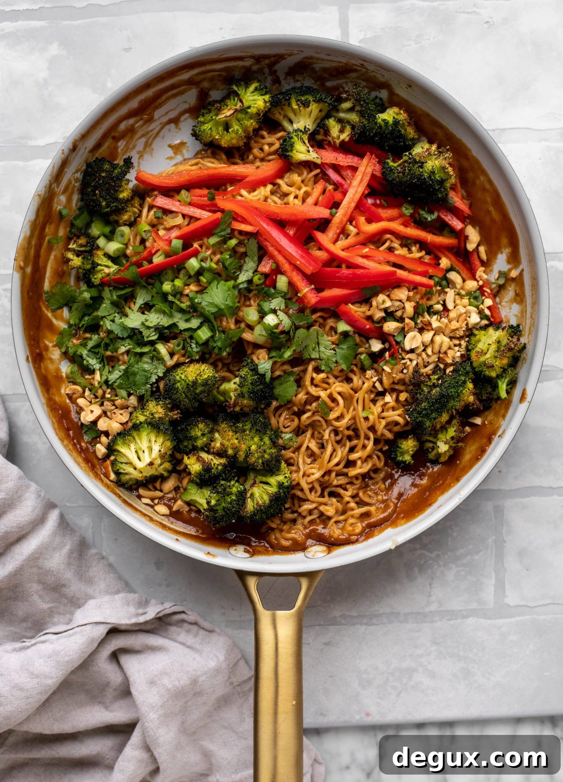 These are the most delicious peanut noodles! Tossed with roasted broccoli, red peppers, scallions, peanuts and an incredibly flavorful sauce!