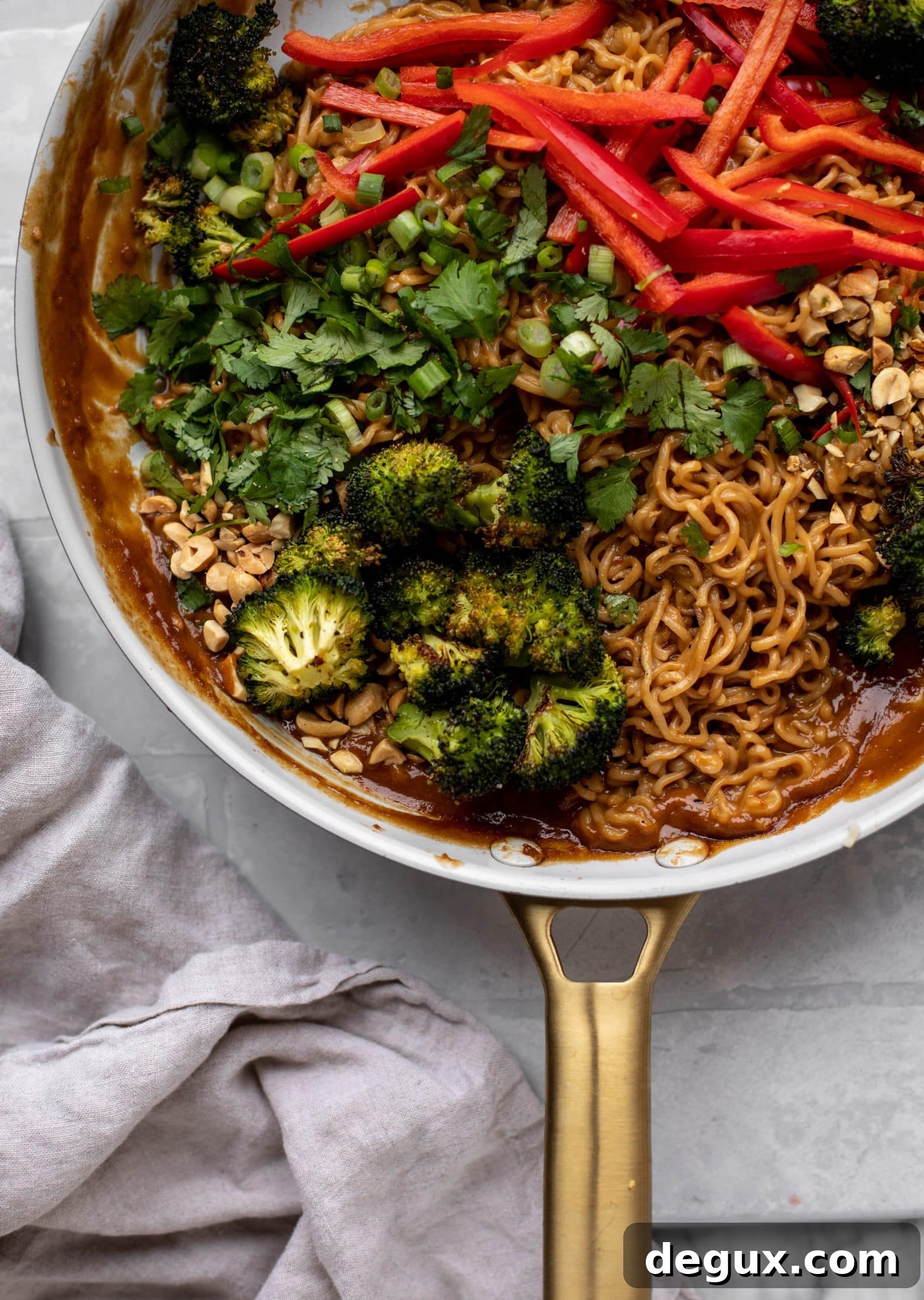 These are the most delicious peanut noodles! Tossed with roasted broccoli, red peppers, scallions, peanuts and an incredibly flavorful sauce!