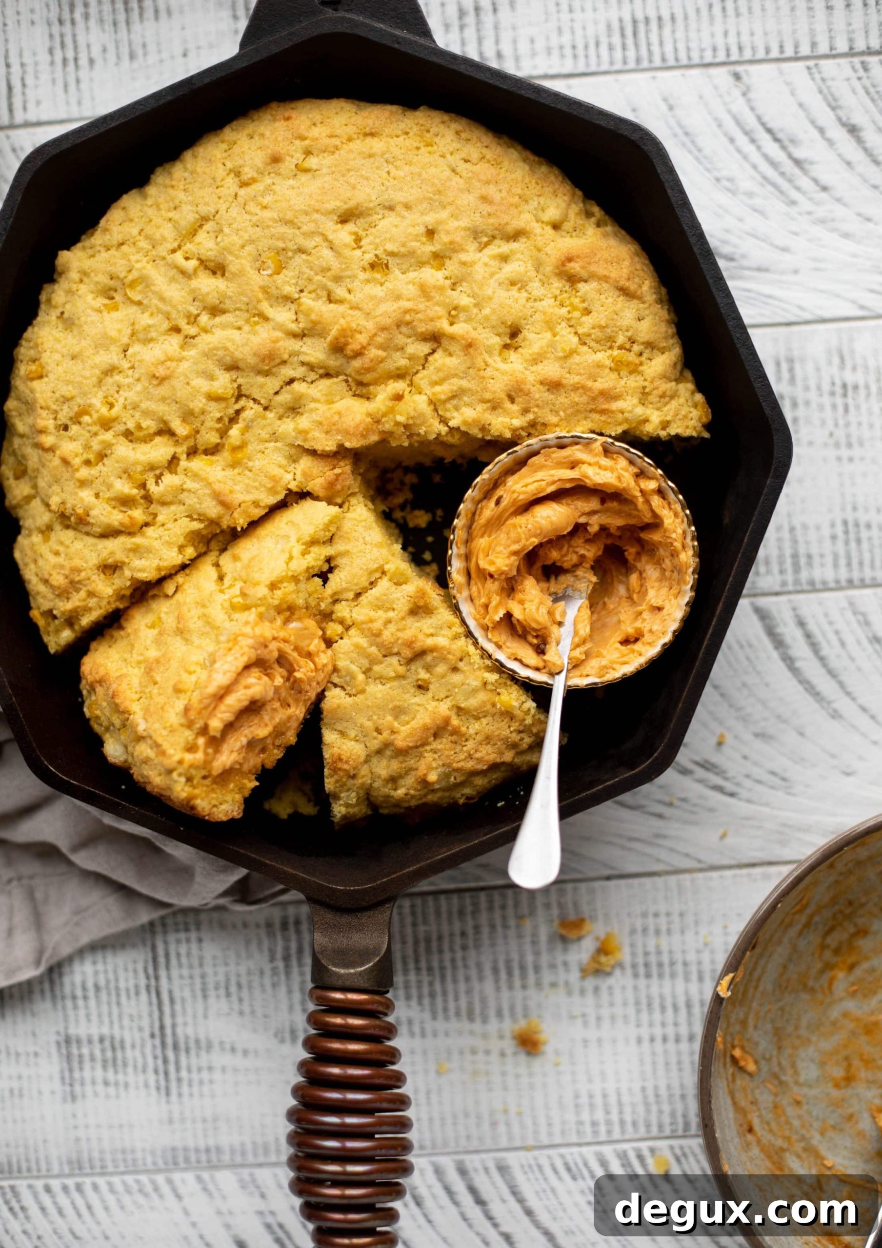 This skillet cornbread is so fluffy and delicious! Serve it hot from the oven with chipotle honey butter. It makes a great appetizer or side dish.