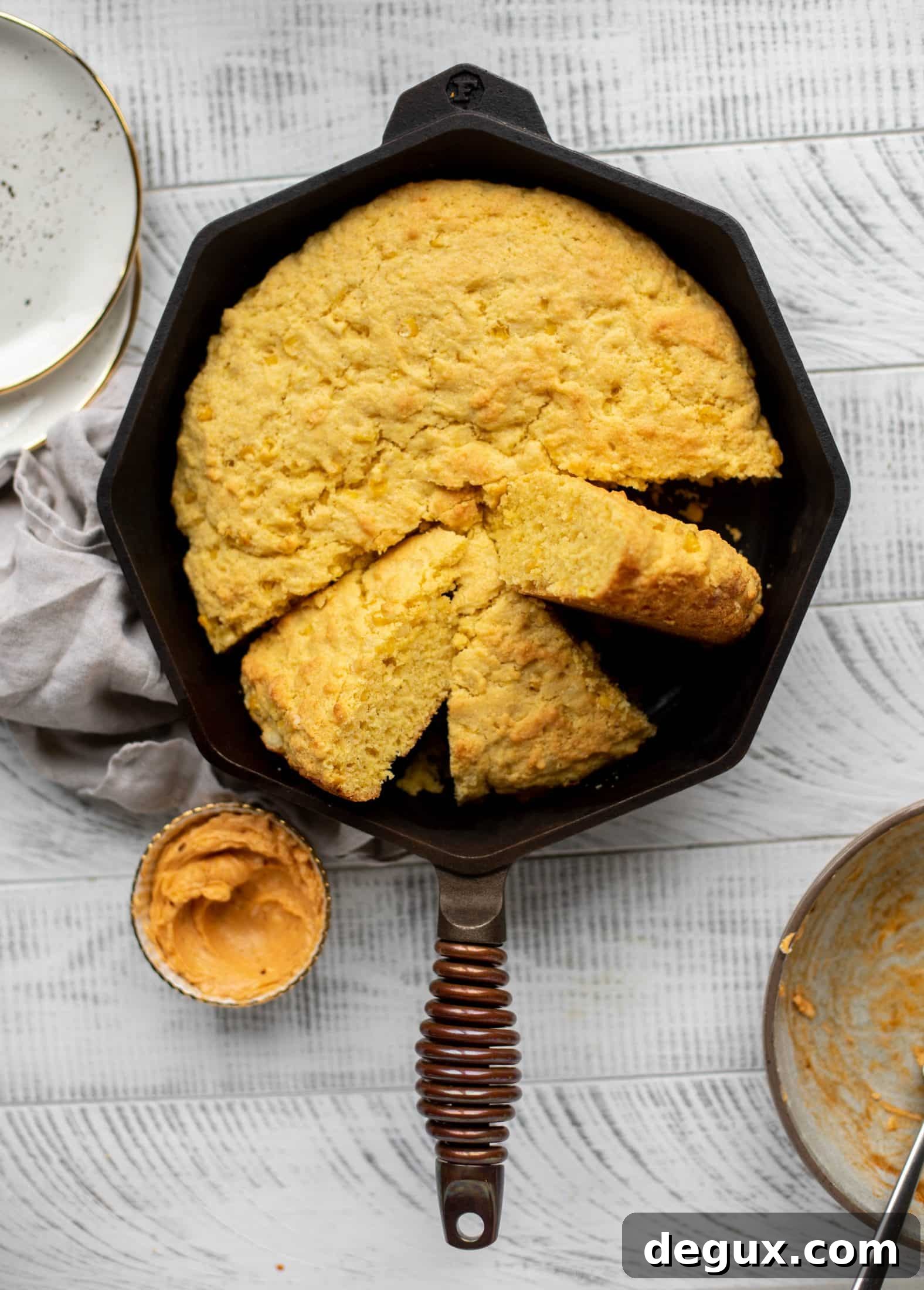 This skillet cornbread is so fluffy and delicious! Serve it hot from the oven with chipotle honey butter. It makes a great appetizer or side dish.
