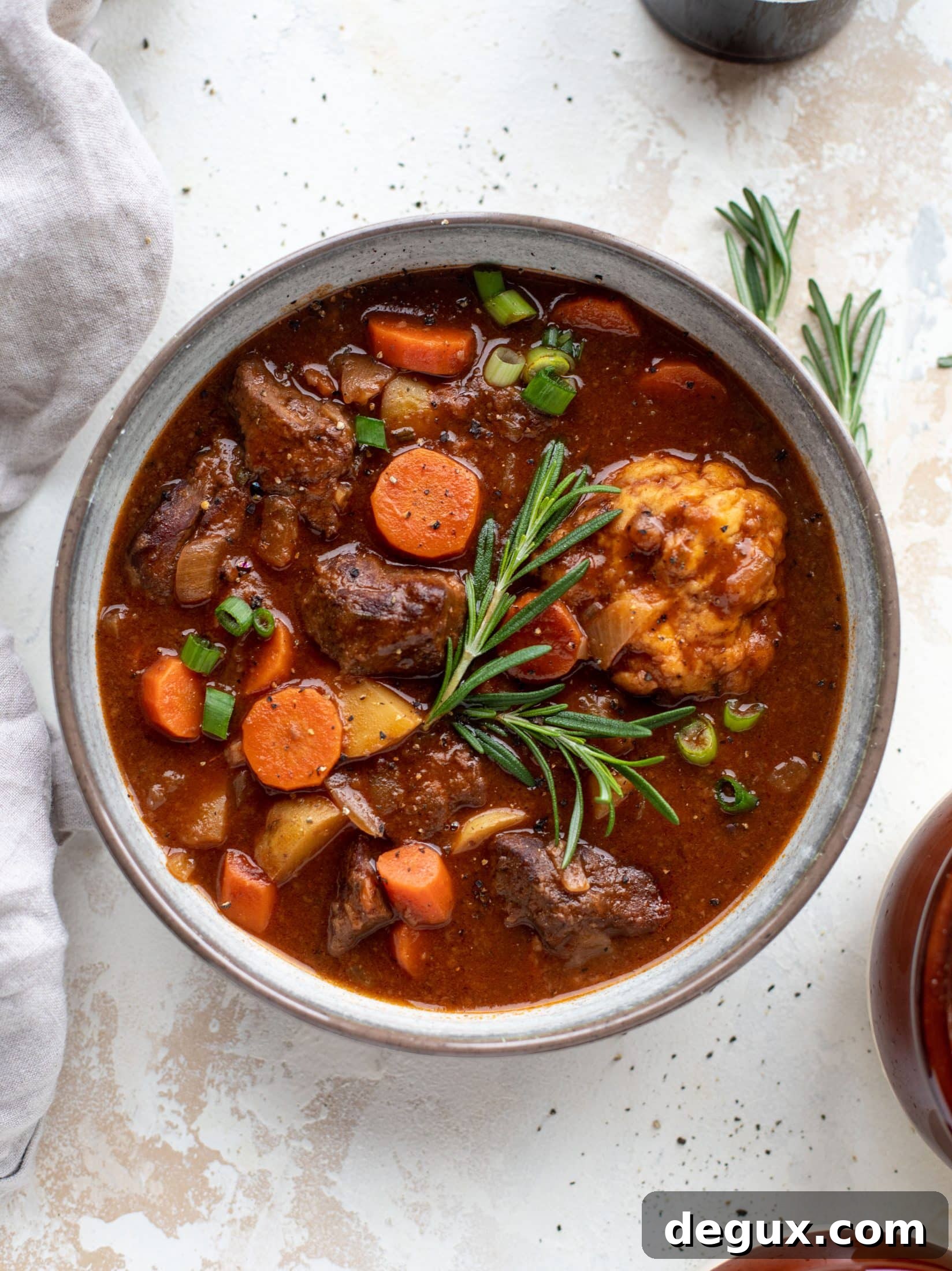 My new favorite soup! Irish stout beef stew is flavorful and hearty and topped with delicious herb dumplings. Perfect comfort food.