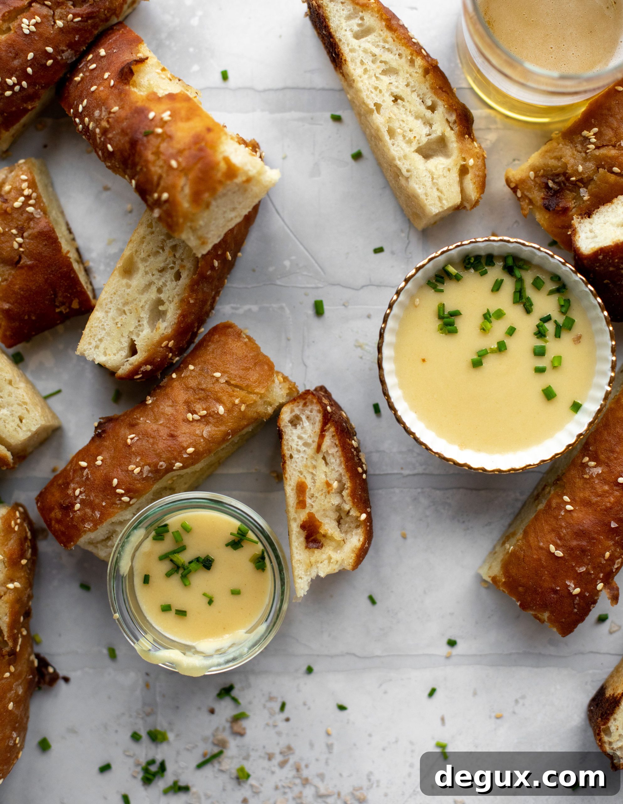 Sesame Pretzel Focaccia with Dijon Beer Cheese Dip 6 This sesame pretzel focaccia bread is amazing! Almost like a soft pretzel with crispy edges. Serve with a delicious dijon beer cheese.
