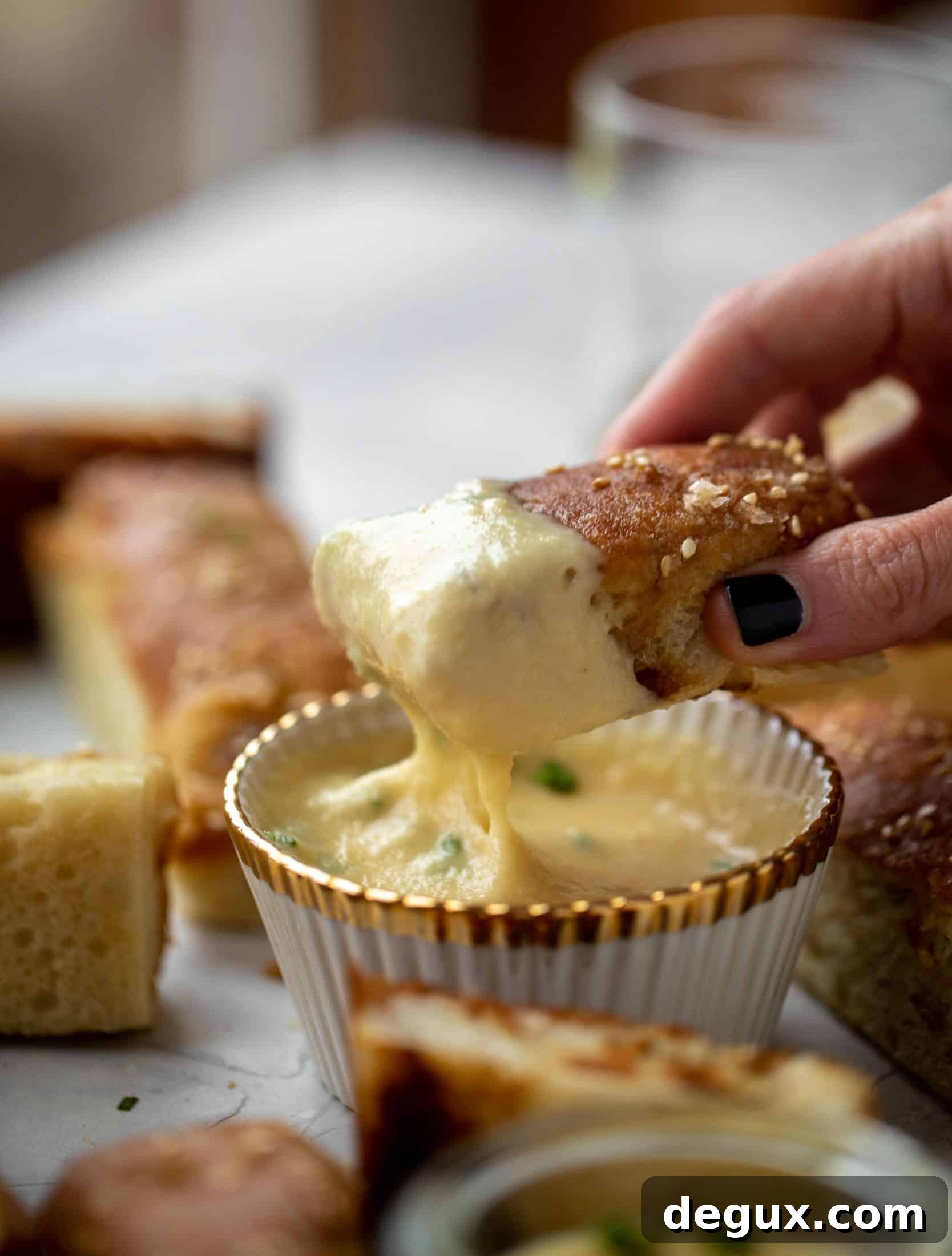Sesame Pretzel Focaccia with Dijon Beer Cheese Dip 7 This sesame pretzel focaccia bread is amazing! Almost like a soft pretzel with crispy edges. Serve with a delicious dijon beer cheese.