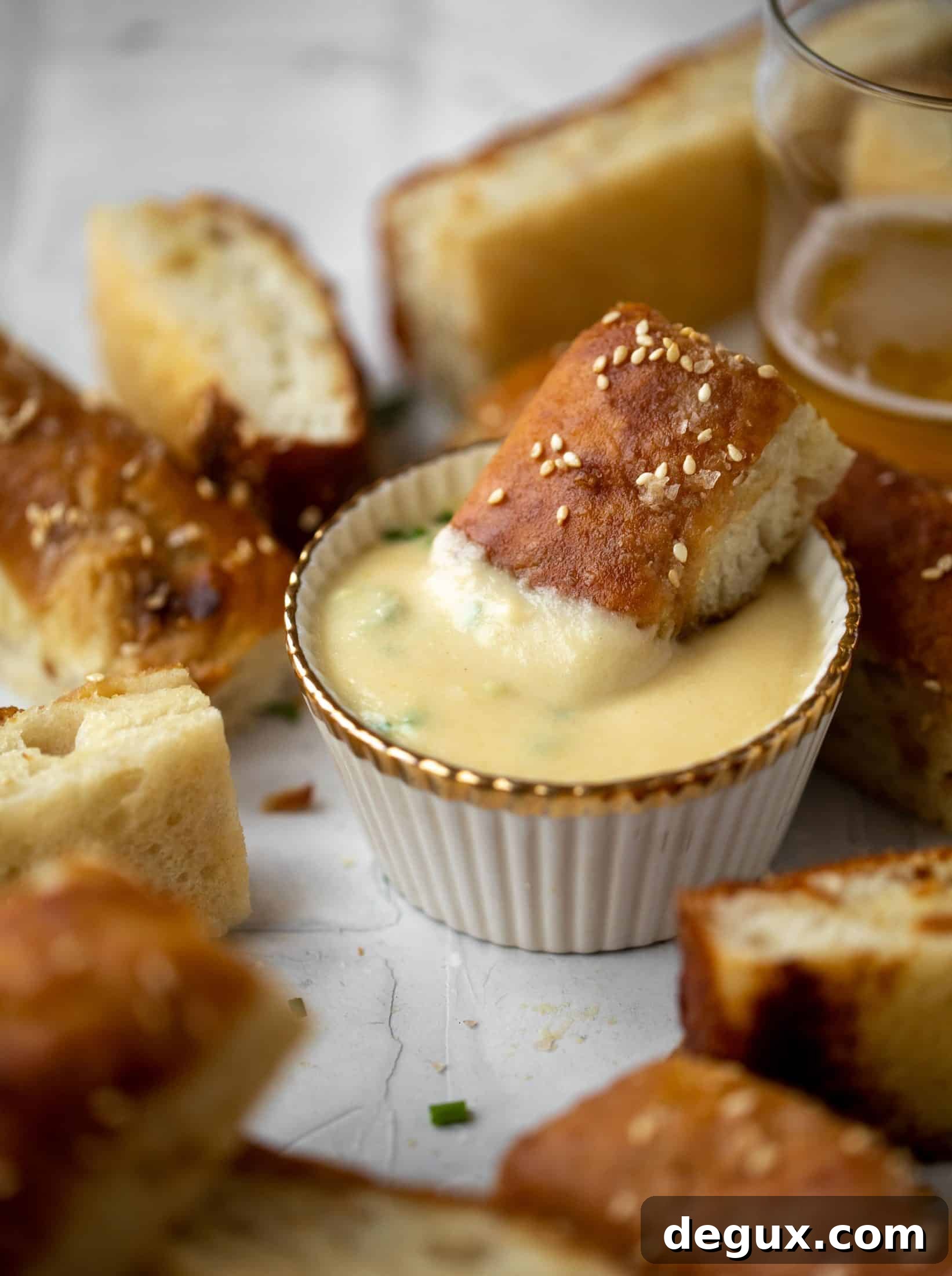 Sesame Pretzel Focaccia with Dijon Beer Cheese Dip 8 This sesame pretzel focaccia bread is amazing! Almost like a soft pretzel with crispy edges. Serve with a delicious dijon beer cheese.