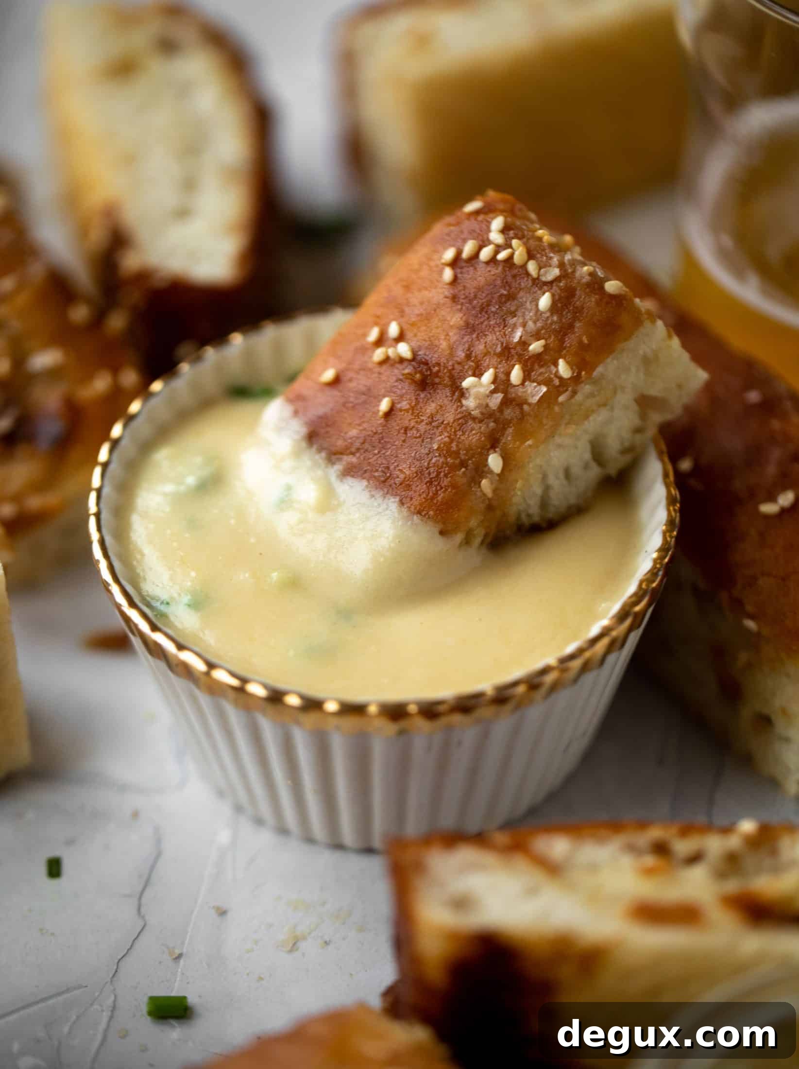 Sesame Pretzel Focaccia with Dijon Beer Cheese Dip 10 This sesame pretzel focaccia bread is amazing! Almost like a soft pretzel with crispy edges. Serve with a delicious dijon beer cheese.