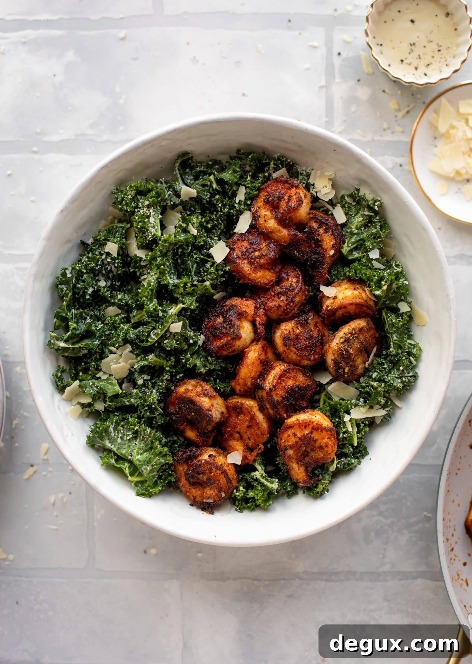 This blackened shrimp kale caesar is loaded with flavor. Spiced, buttery shrimp pan fried until golden, then thrown on kale caesar salad. Delish!