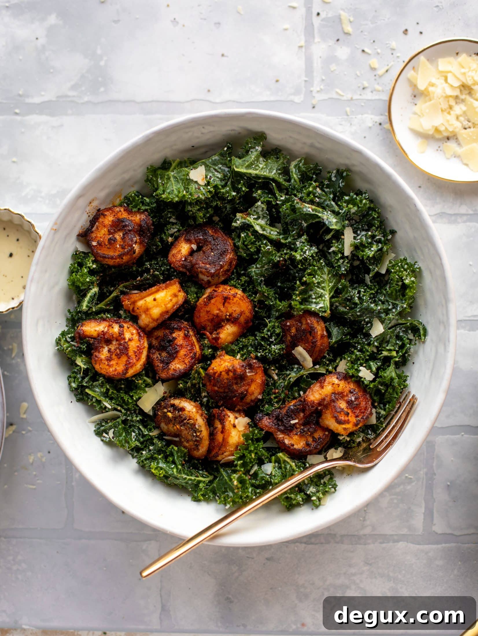 This blackened shrimp kale caesar is loaded with flavor. Spiced, buttery shrimp pan fried until golden, then thrown on kale caesar salad. Delish!