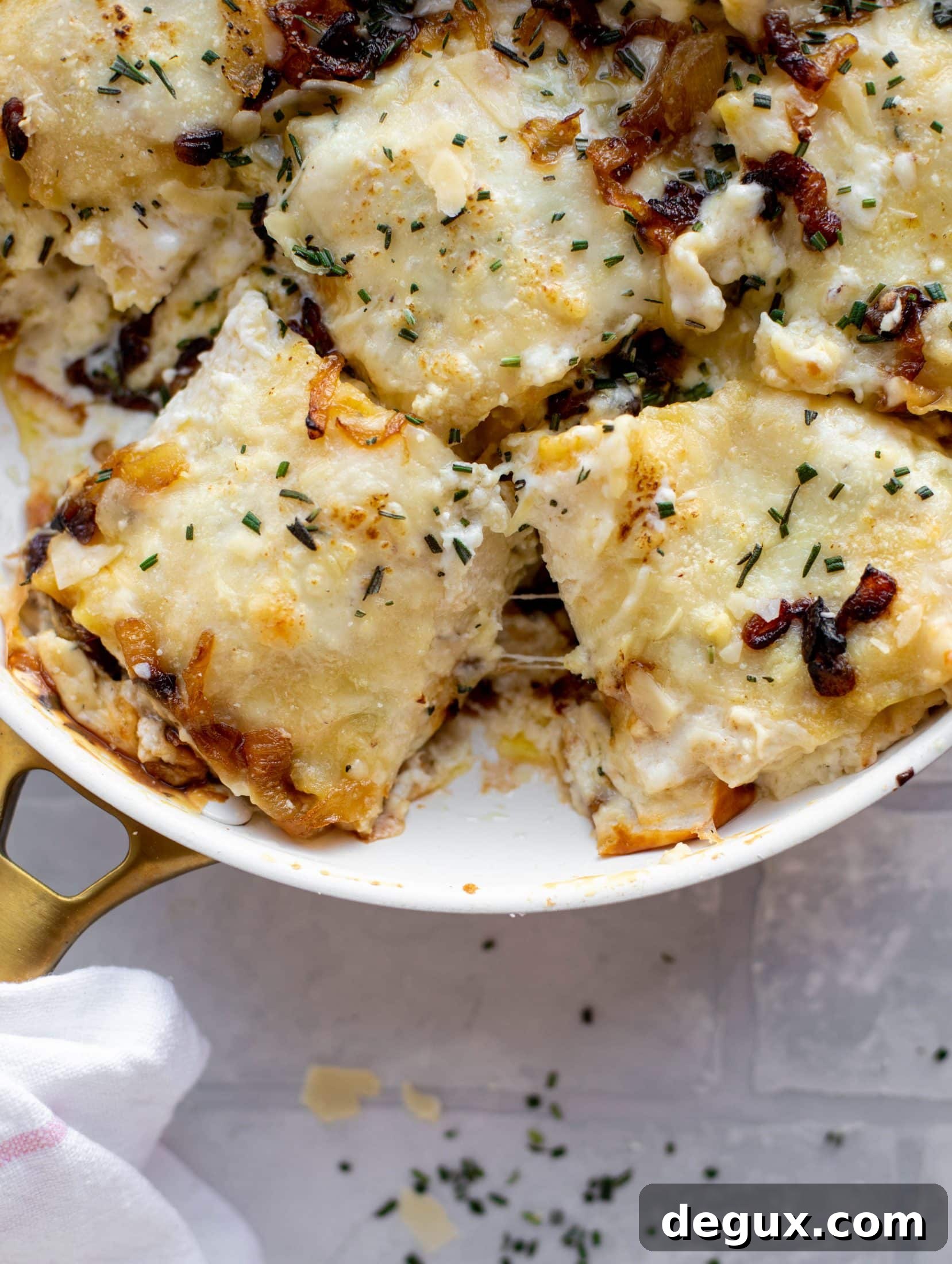 French Onion Chicken Lasagna Roll-Ups Recipe for Savory Weeknight Meals 2 These french onion chicken lasagna roll ups are loaded with flavor! Creamy sauce, chicken, spinach, caramelized onions and gruyere cheese. Love!