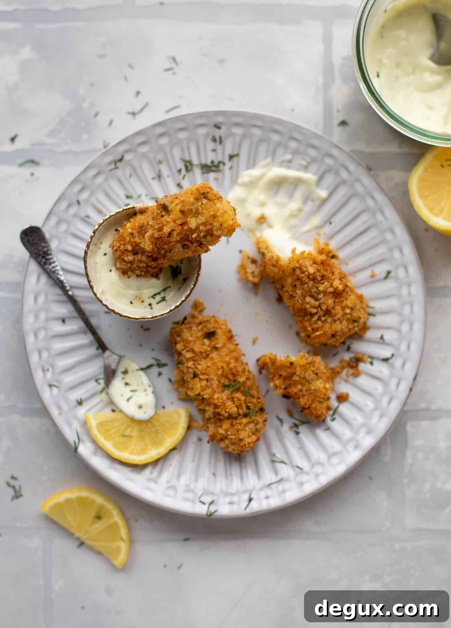 Crispy Lemon-Garlic Fish Sticks with Jalapeño Tartar Sauce 10 These crispy homemade fish sticks are flavored with lemon and garlic! They are super crunchy and delicious when dipped in the jalapeño tartar sauce.