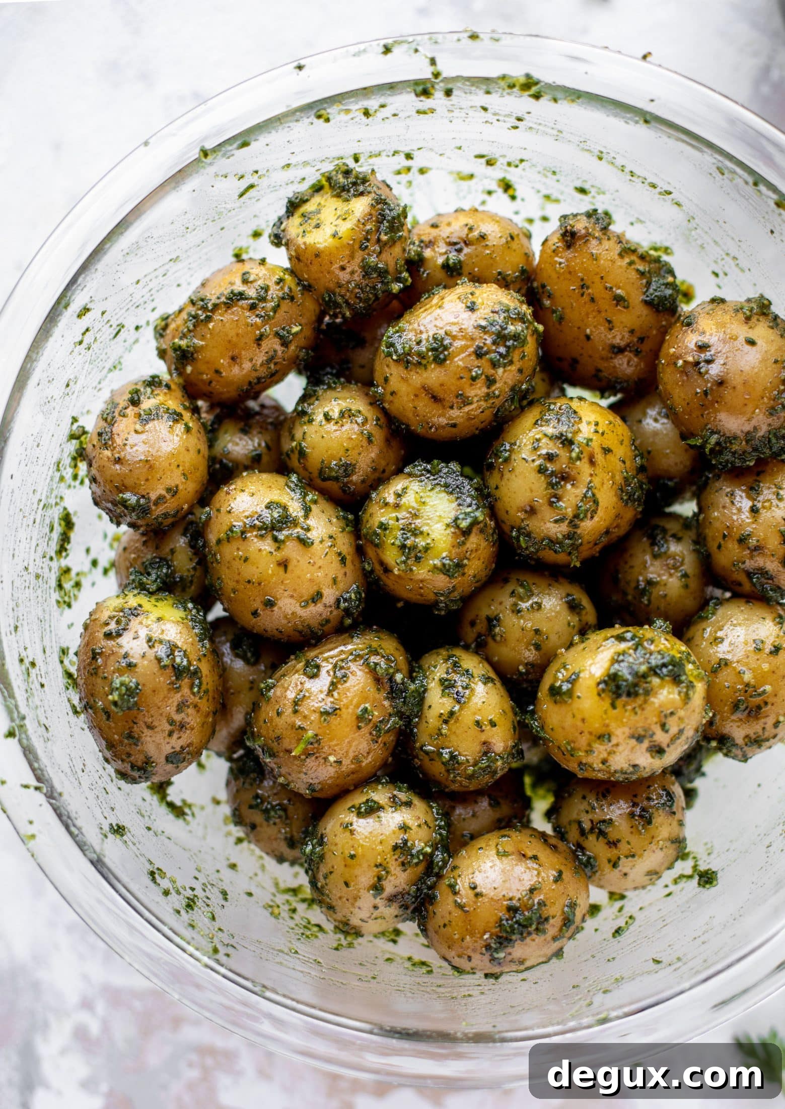 Carrot Top Pesto Potato Salad Recipe — Bright, Herbaceous Side Dish 7 This pesto potato salad is made with carrot top pesto for the perfect spring side dish! Baby potatoes, pesto and greens make up this delish bowl.