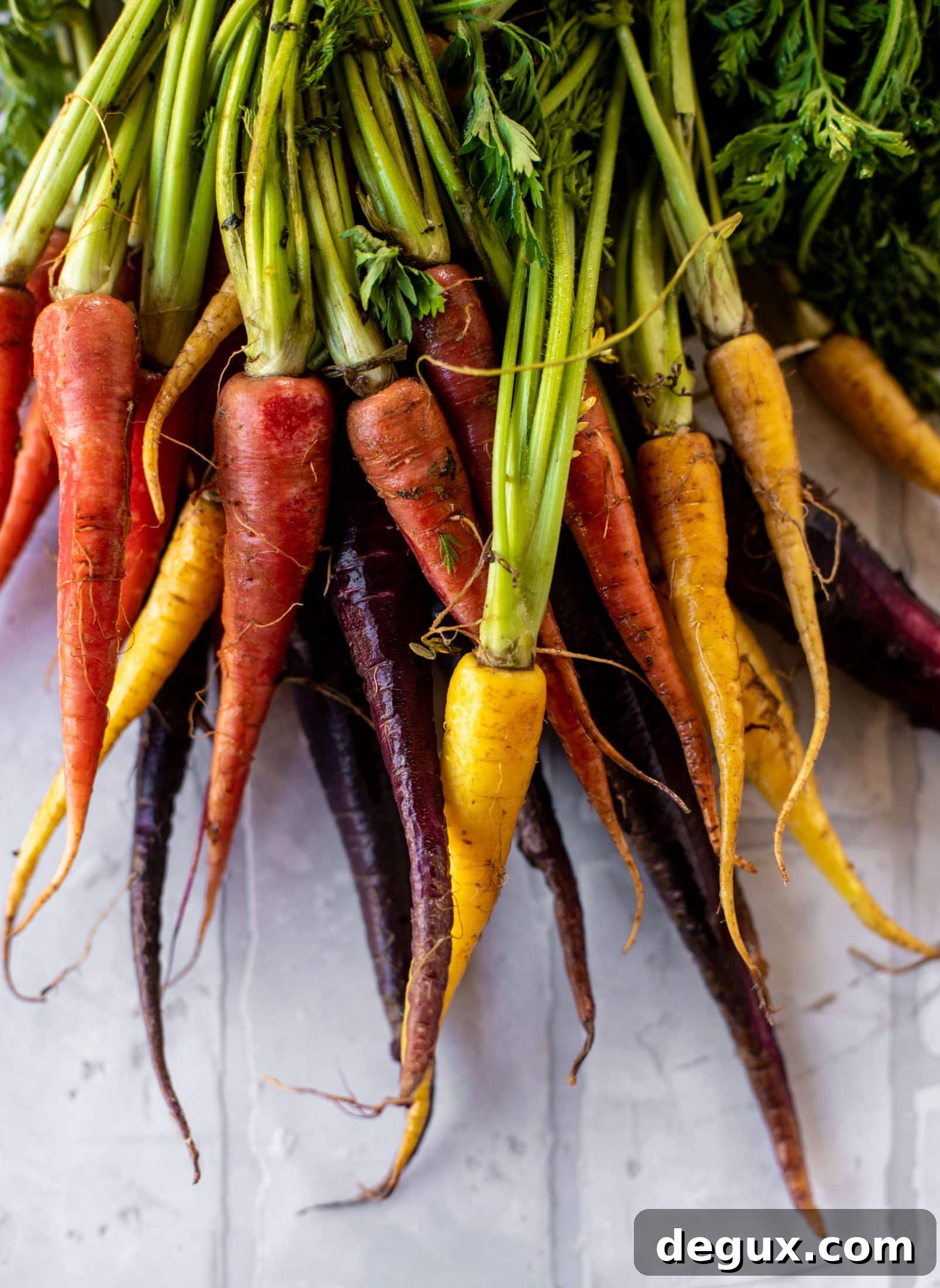 This roasted carrot salad is perfect for spring! Caramely, roasted carrots served over butter greens dressing with green goddess. Simple but delish.