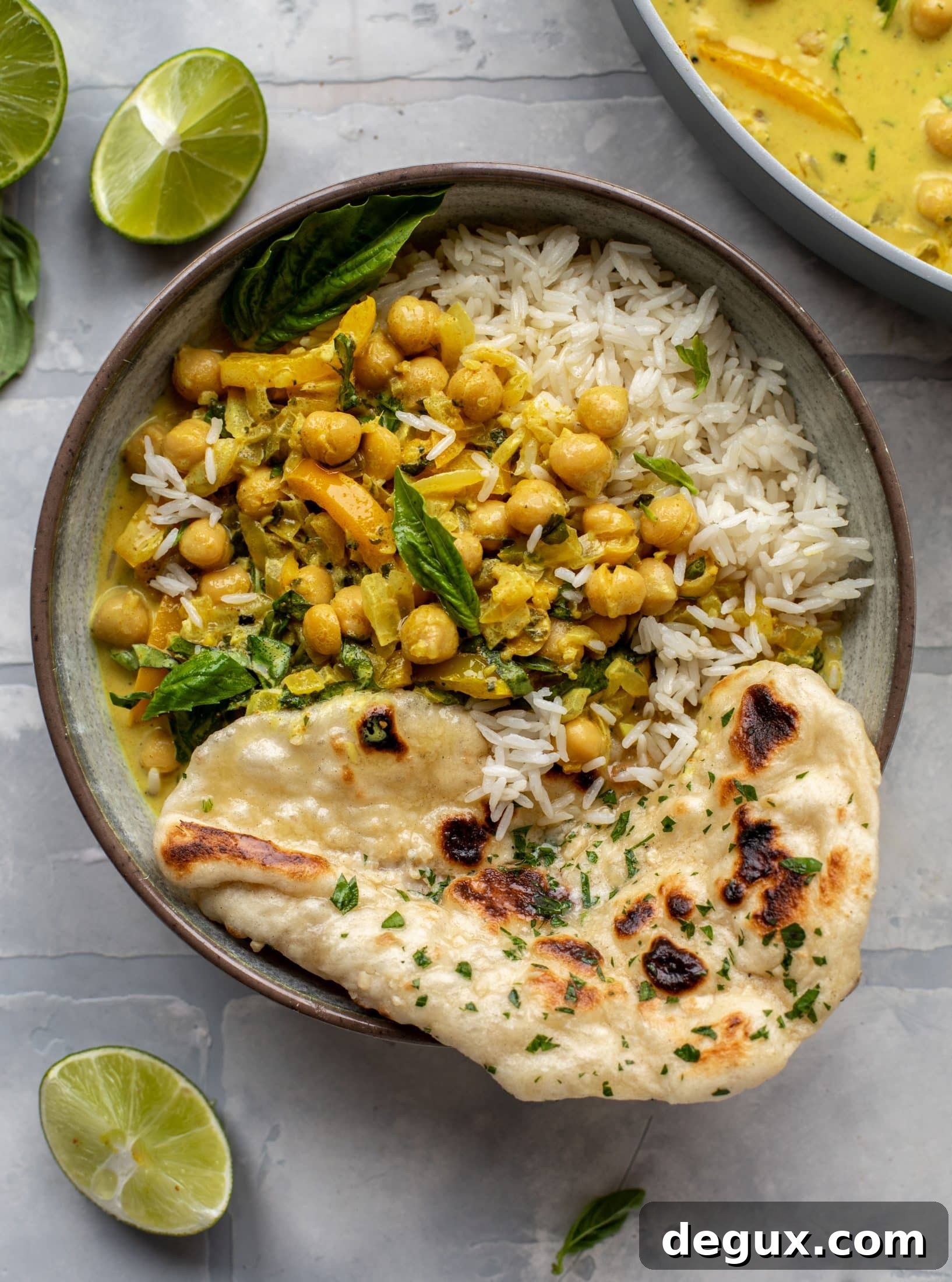 This basil chickpea coconut curry comes together in 20 minutes! Serve with jasmine rice or your favorite naan, or both! So easy and flavorful.
