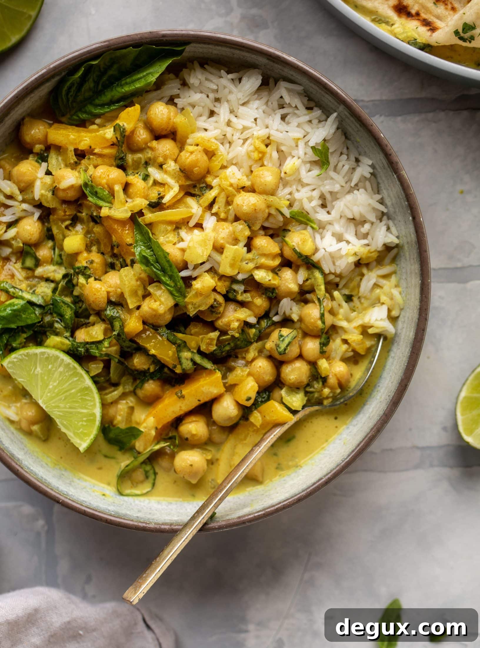 This basil chickpea coconut curry comes together in 20 minutes! Serve with jasmine rice or your favorite naan, or both! So easy and flavorful.