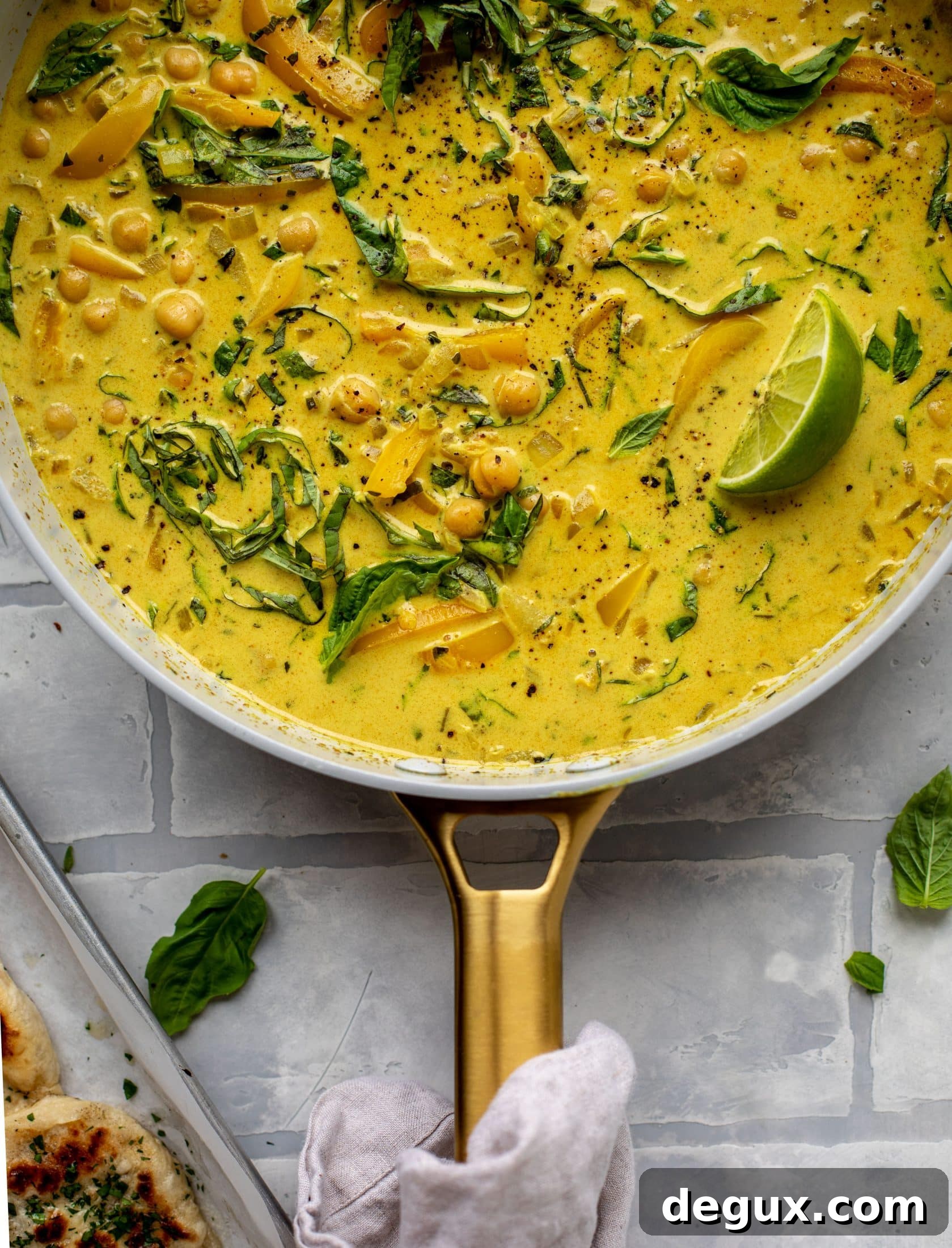 This basil chickpea coconut curry comes together in 20 minutes! Serve with jasmine rice or your favorite naan, or both! So easy and flavorful.