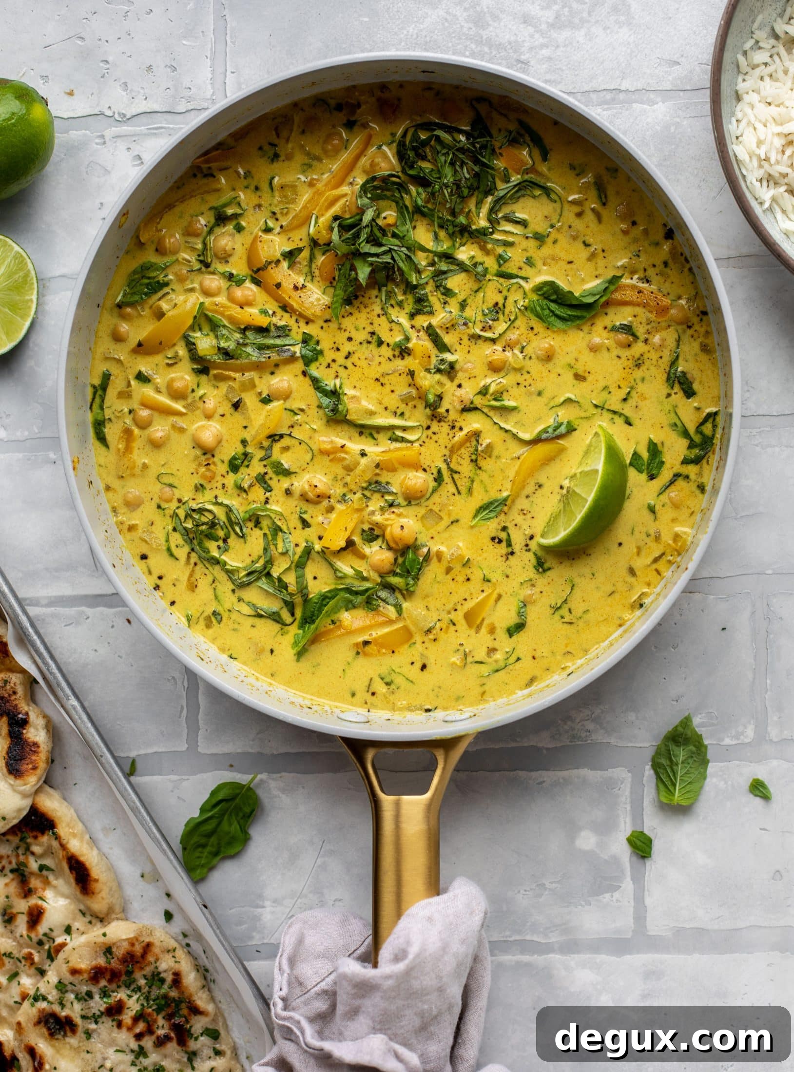This basil chickpea coconut curry comes together in 20 minutes! Serve with jasmine rice or your favorite naan, or both! So easy and flavorful.
