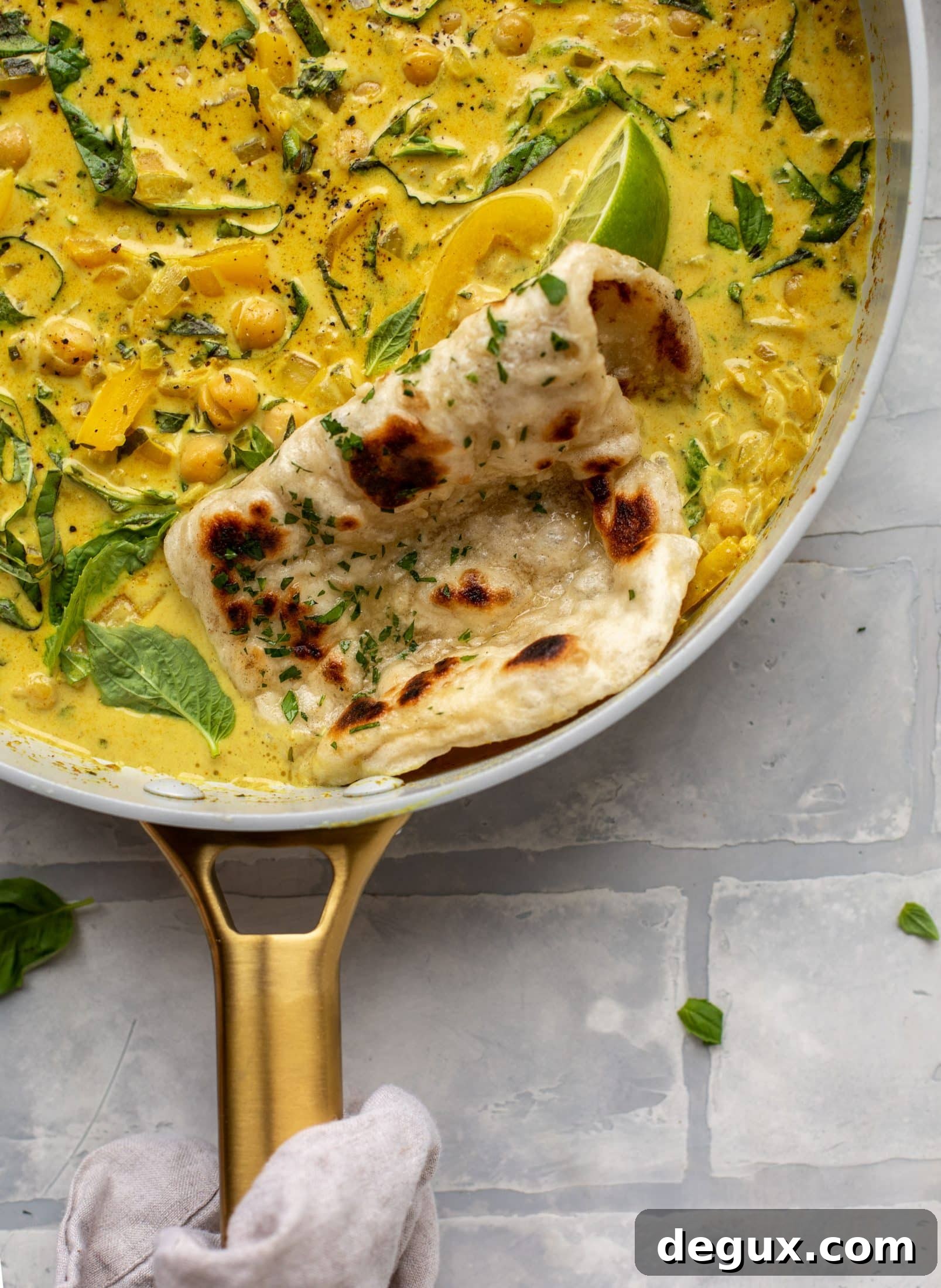 This basil chickpea coconut curry comes together in 20 minutes! Serve with jasmine rice or your favorite naan, or both! So easy and flavorful.
