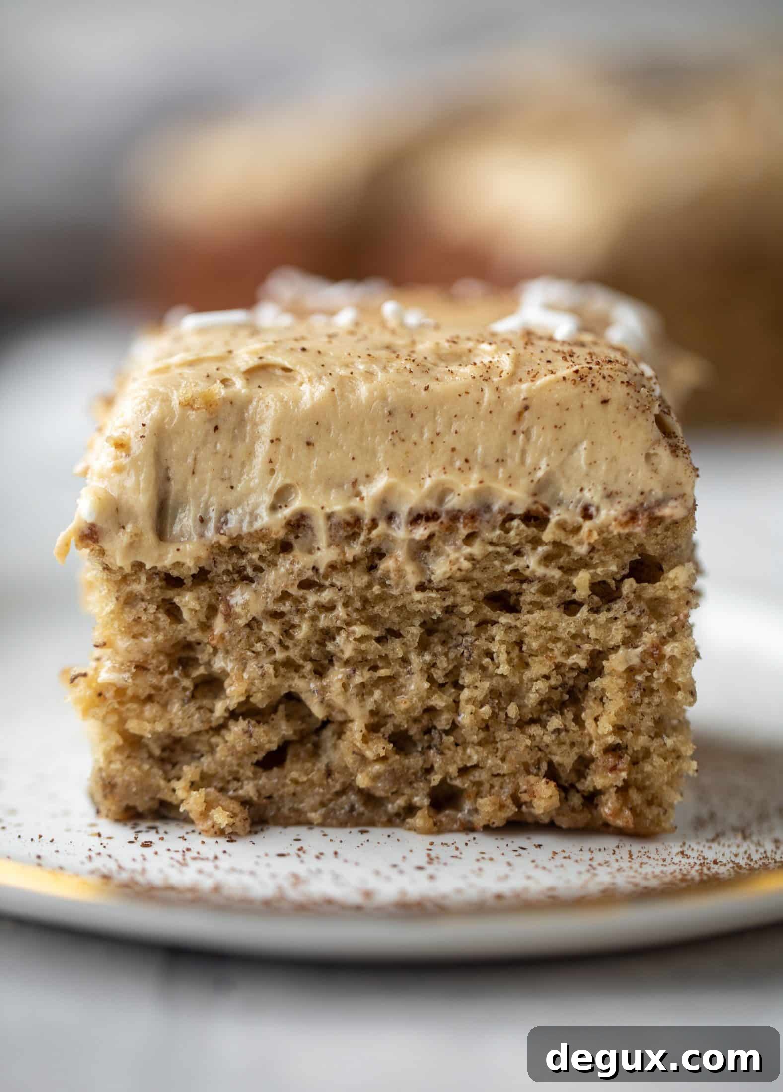 This banana cake is a delicious twist on banana bread! Covered with coffee cream cheese frosting, it’s an easy and wonderful treat.